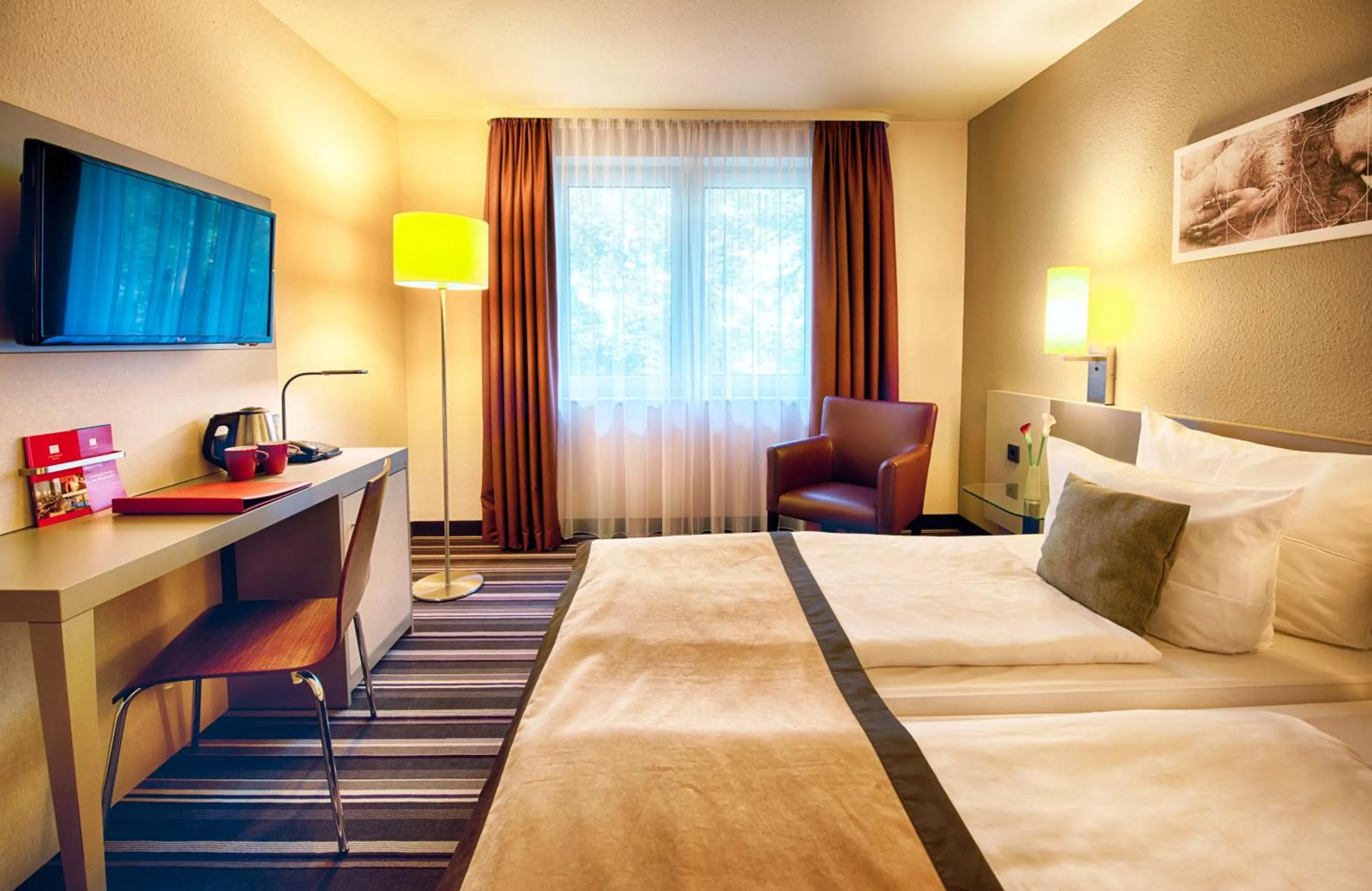 Photo of the whole room, Bed in Leonardo Hotel Mannheim-Ladenburg