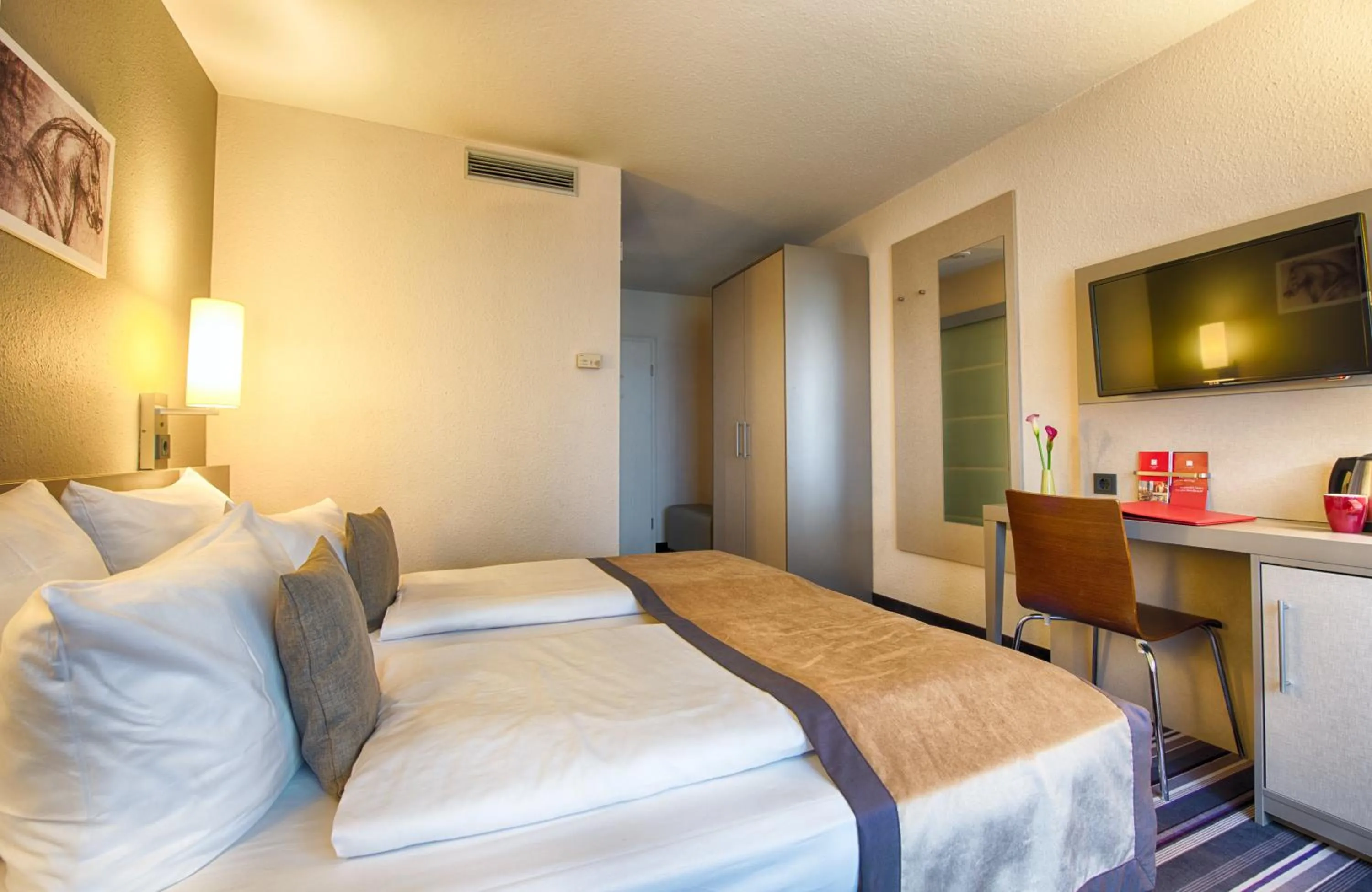 Photo of the whole room, Bed in Leonardo Hotel Mannheim-Ladenburg