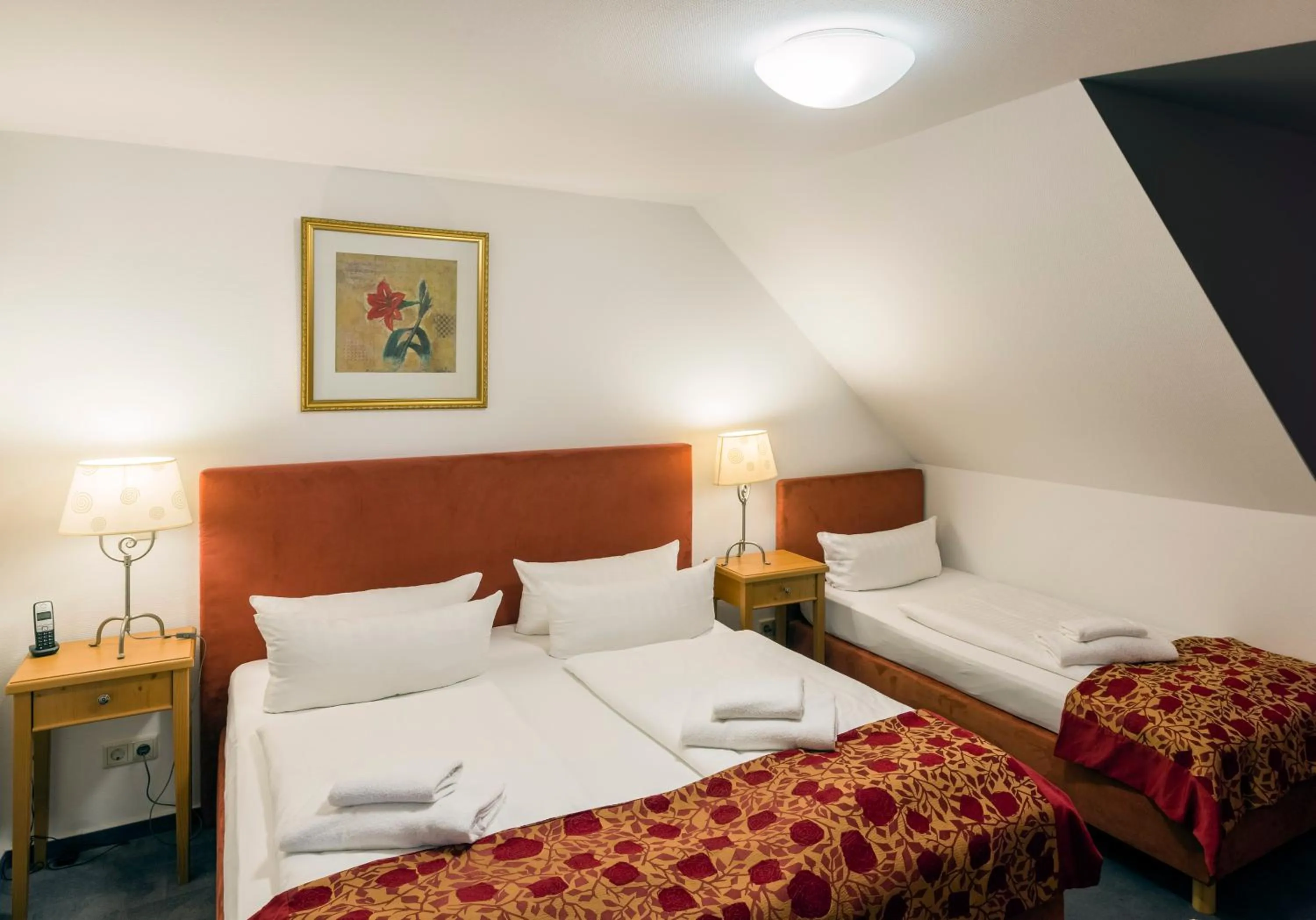 Bed in Apparthotel Bad Schandau by STEIGER Hotels