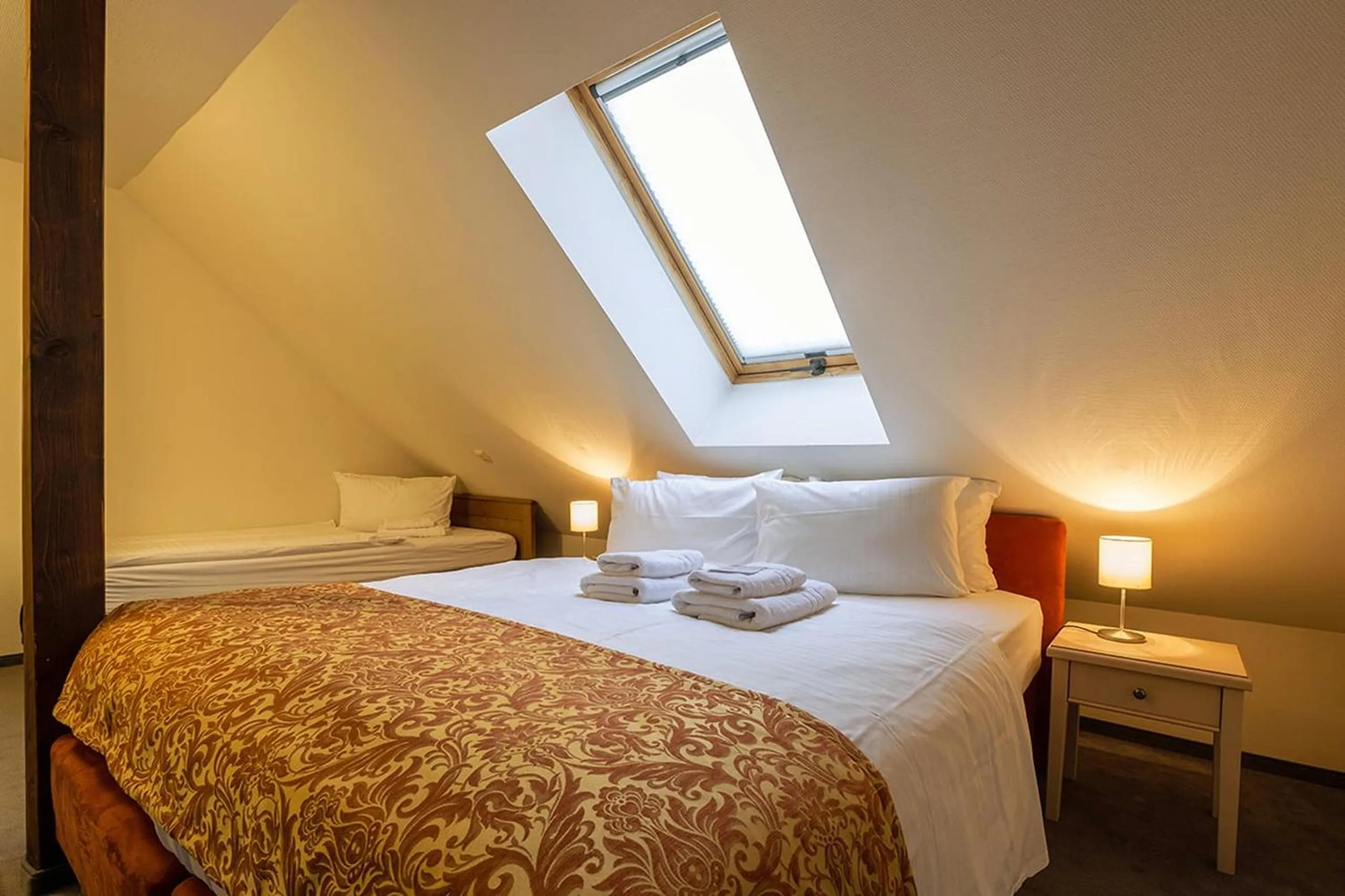 Bed in Apparthotel Bad Schandau by STEIGER Hotels