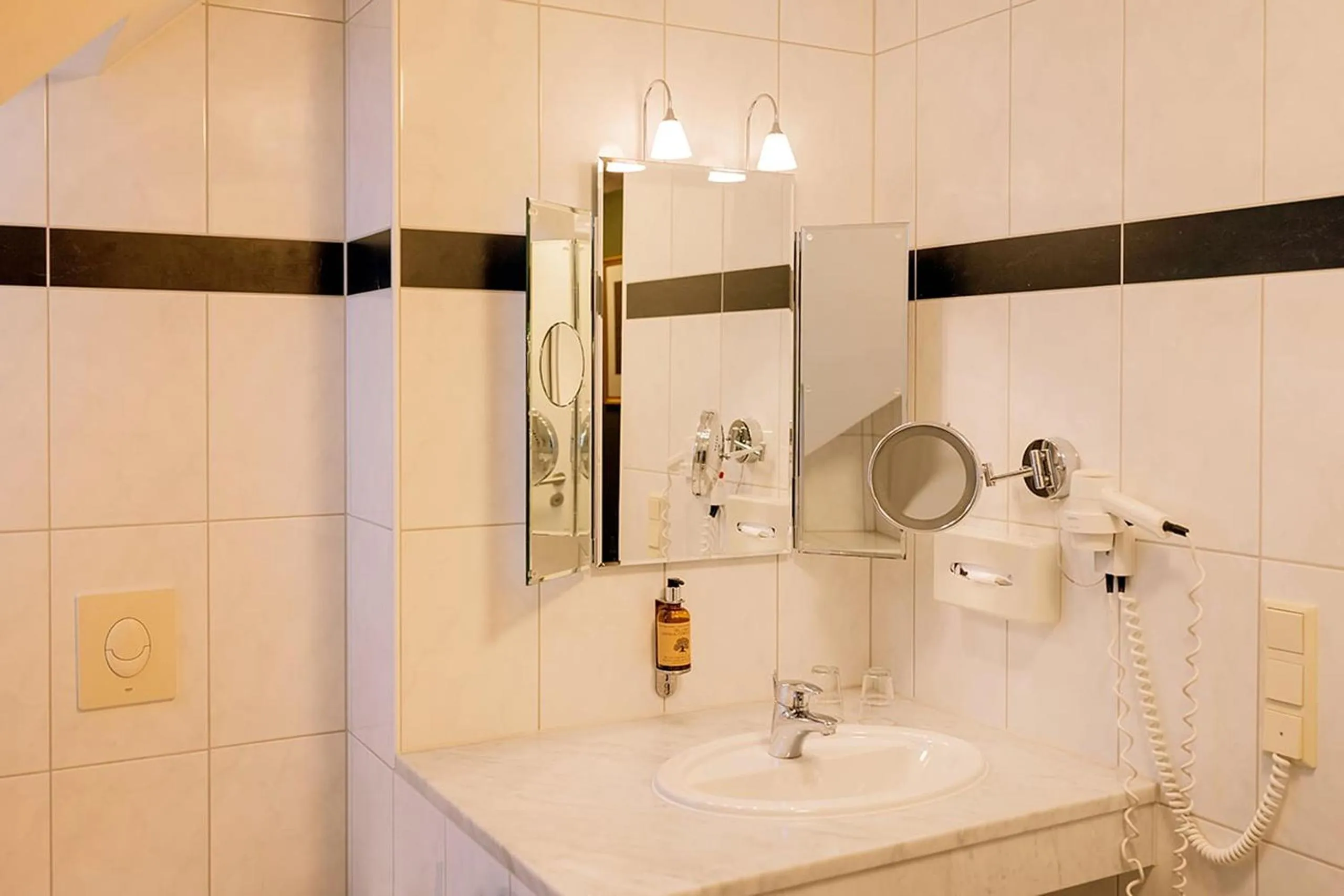 Bathroom in Apparthotel Bad Schandau by STEIGER Hotels