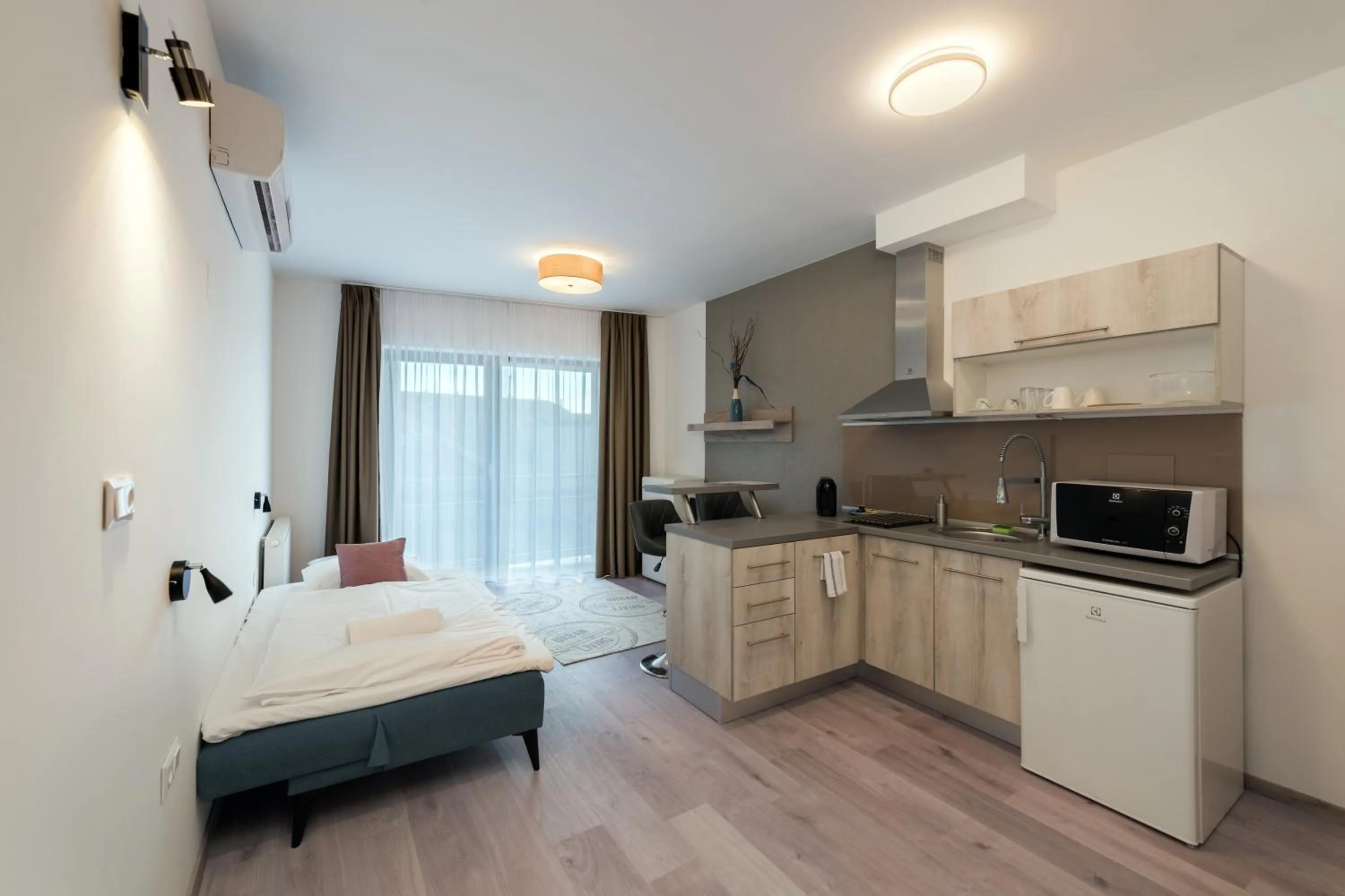 Kitchen or kitchenette, Bed in Fibula Residence Hotel & Wellness - Adults Only