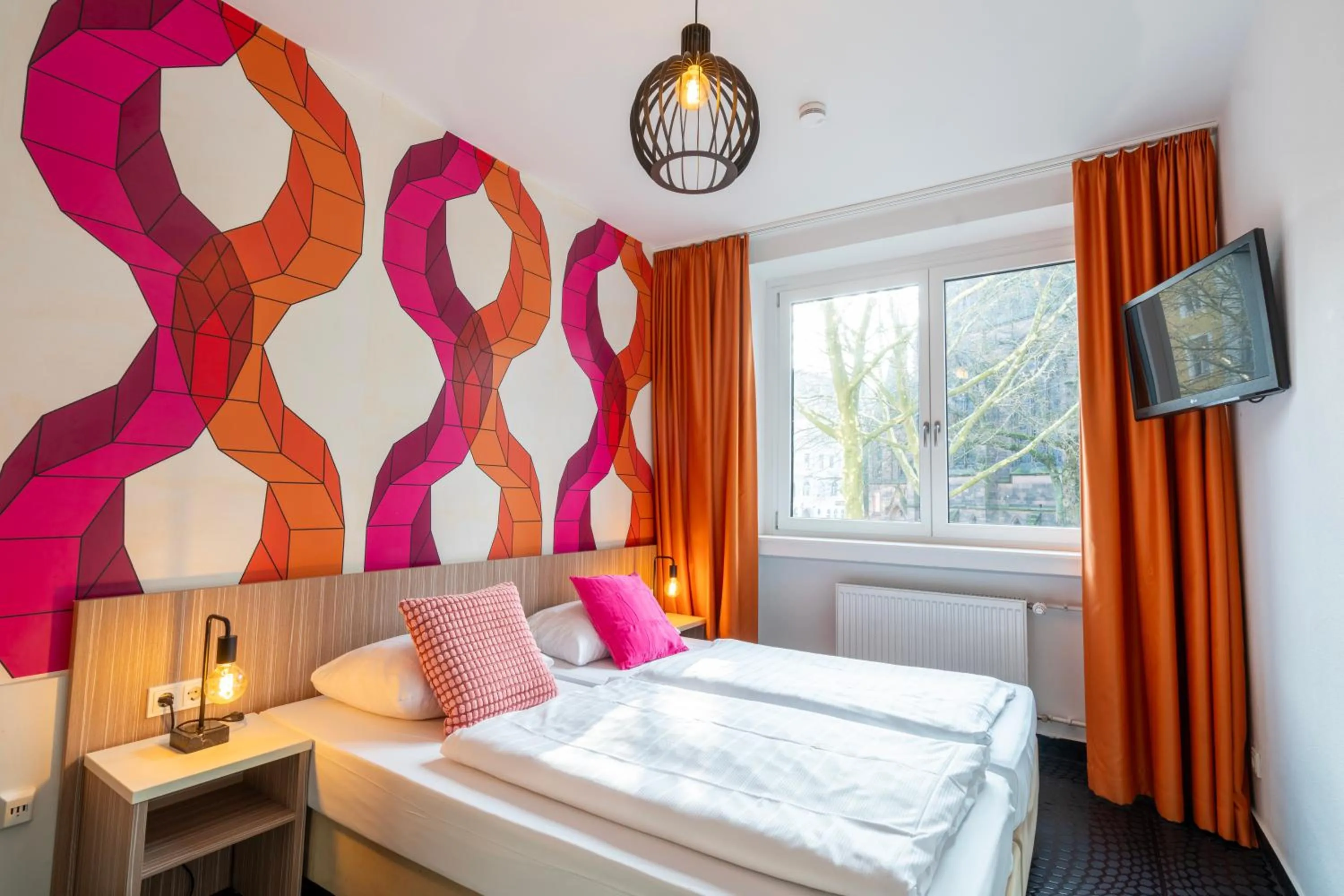 Bed in Hotel Madeleine Biohotel