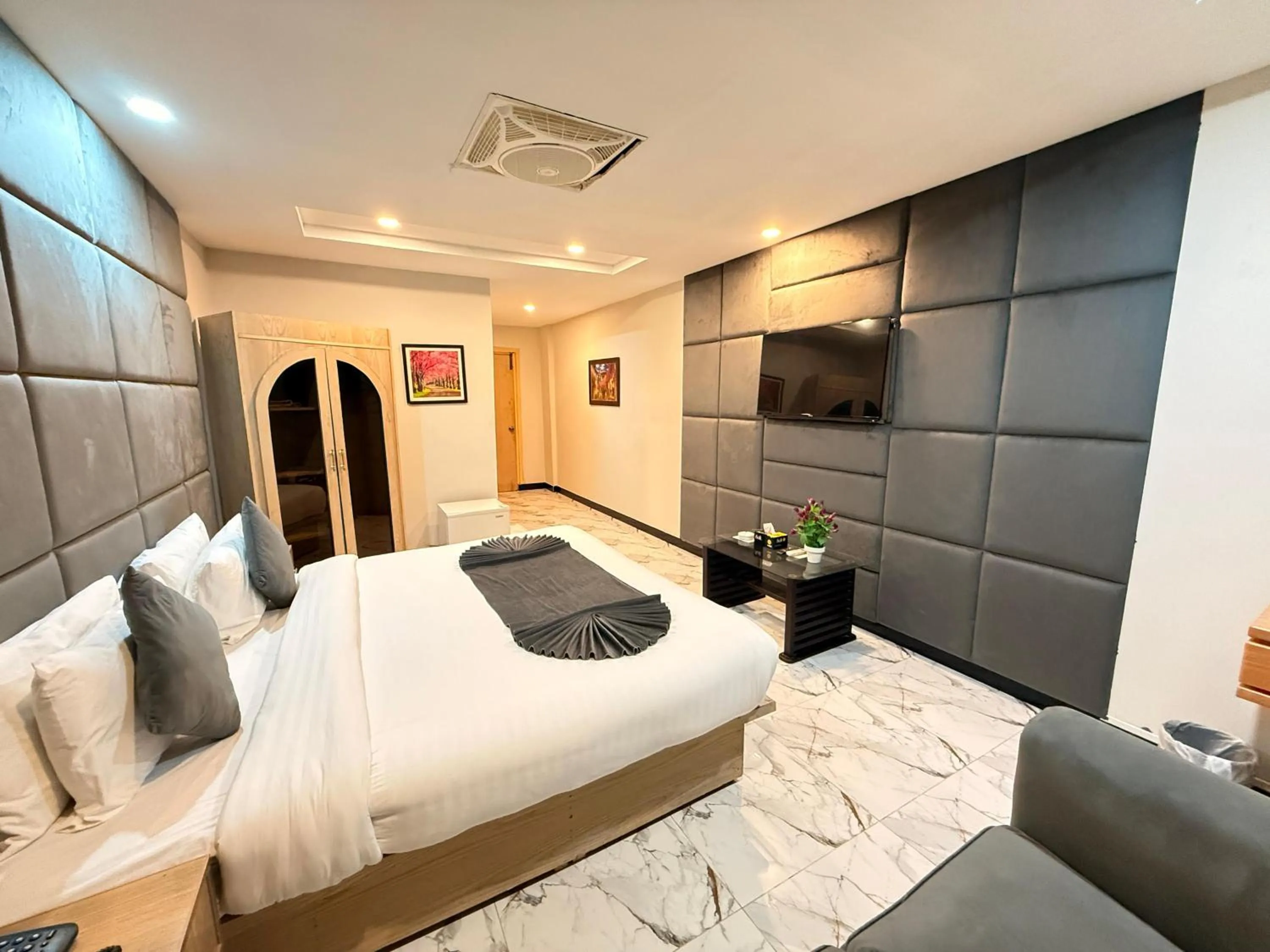 Bed in Atlas Hotel Islamabad