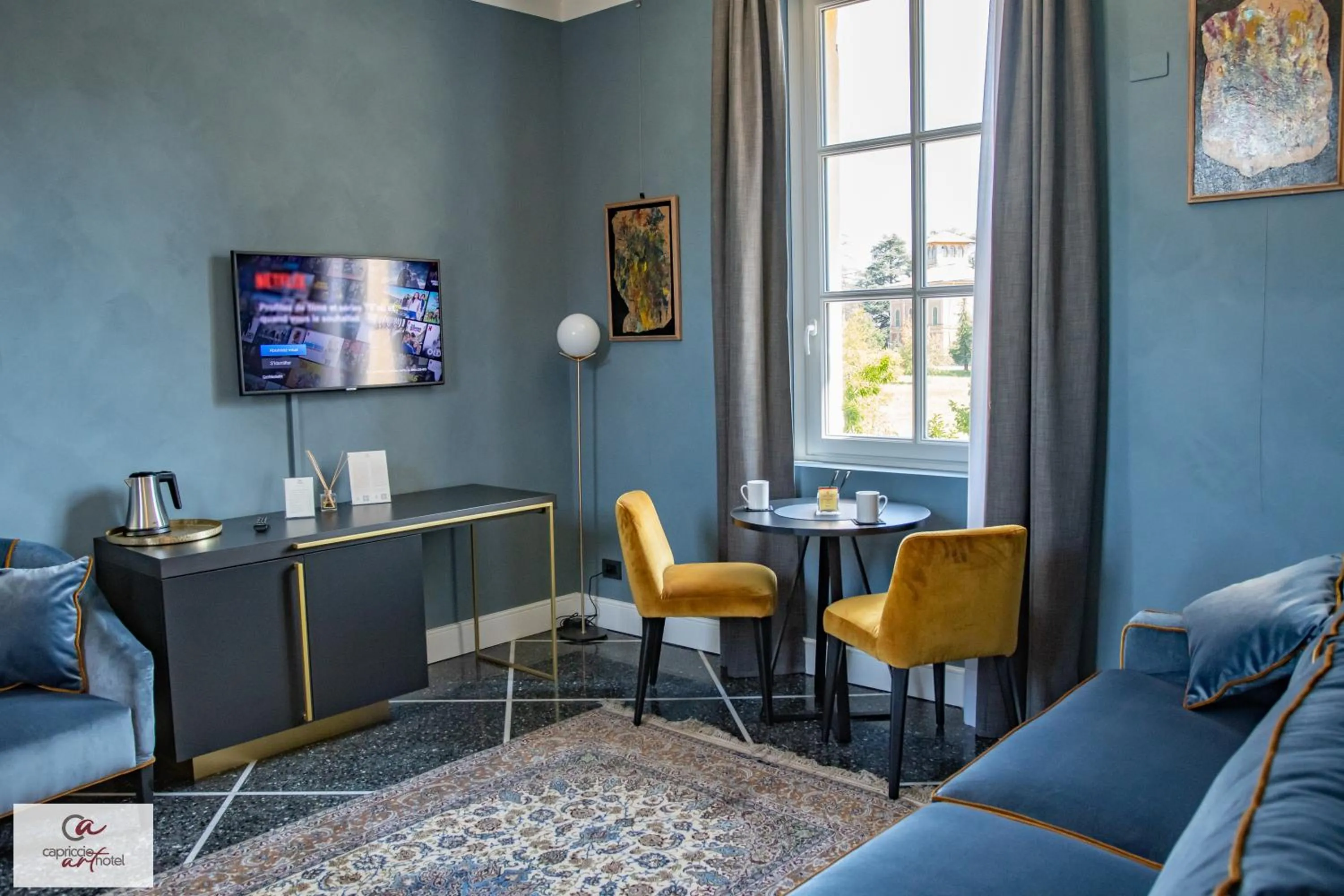 Living room in Capriccio Art Hotel