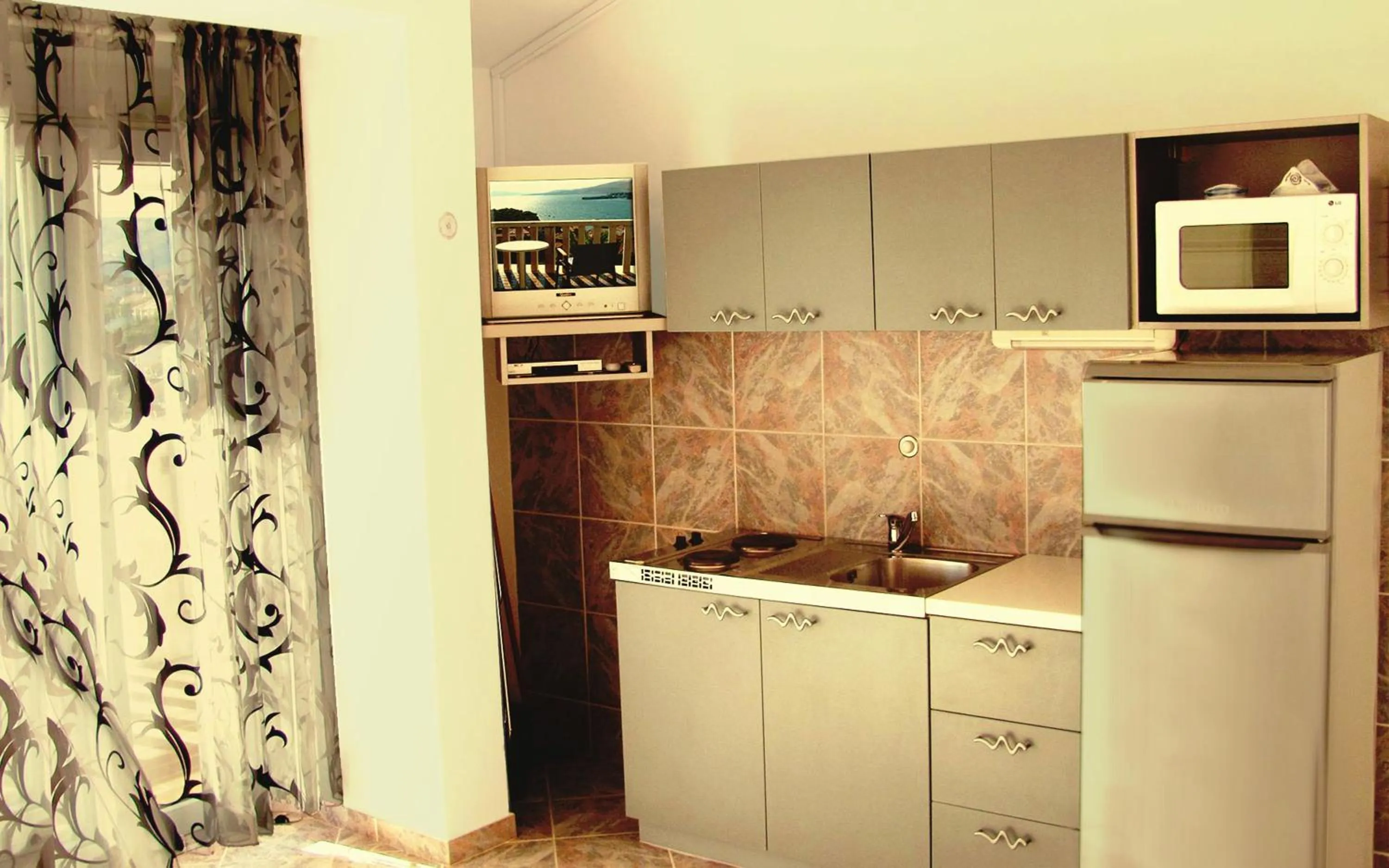 kitchen in Beautiful apartment for two persons with sea view in Trogir near the beach