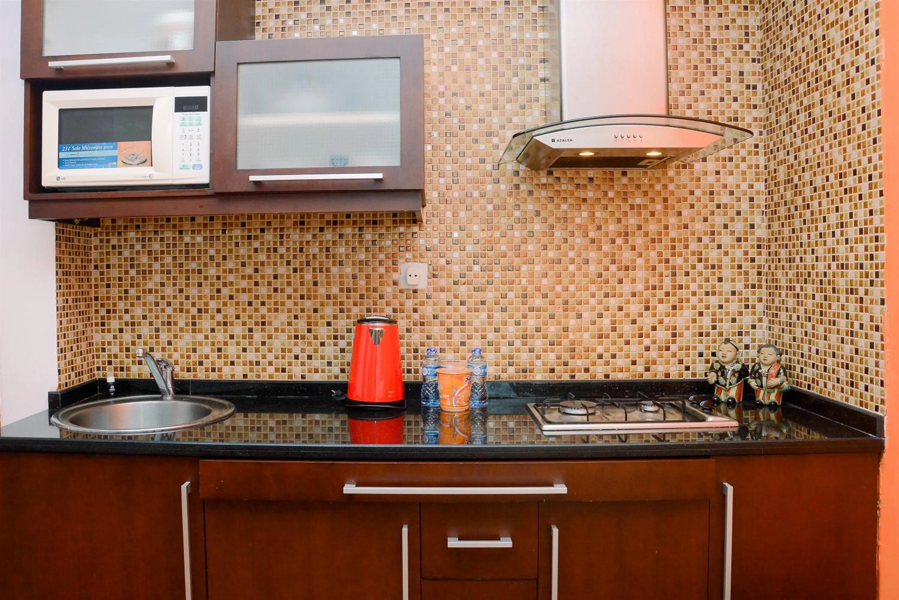 Kitchen or kitchenette in Comfortable 2BR Apartment at Mediterania Palace Residence By Travelio