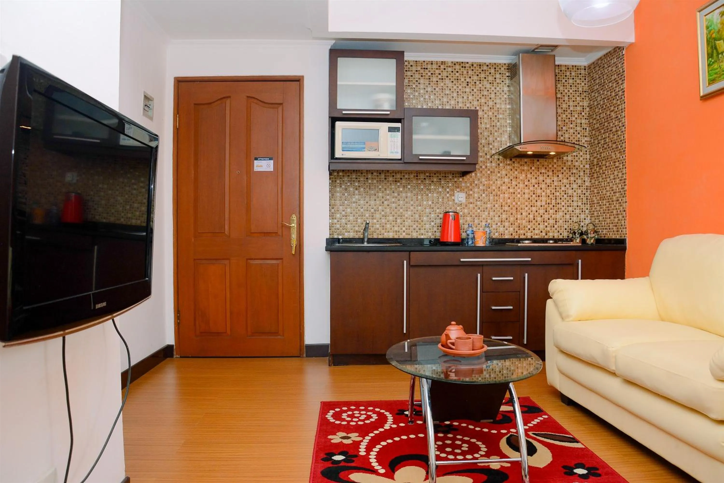 Living room in Comfortable 2BR Apartment at Mediterania Palace Residence By Travelio
