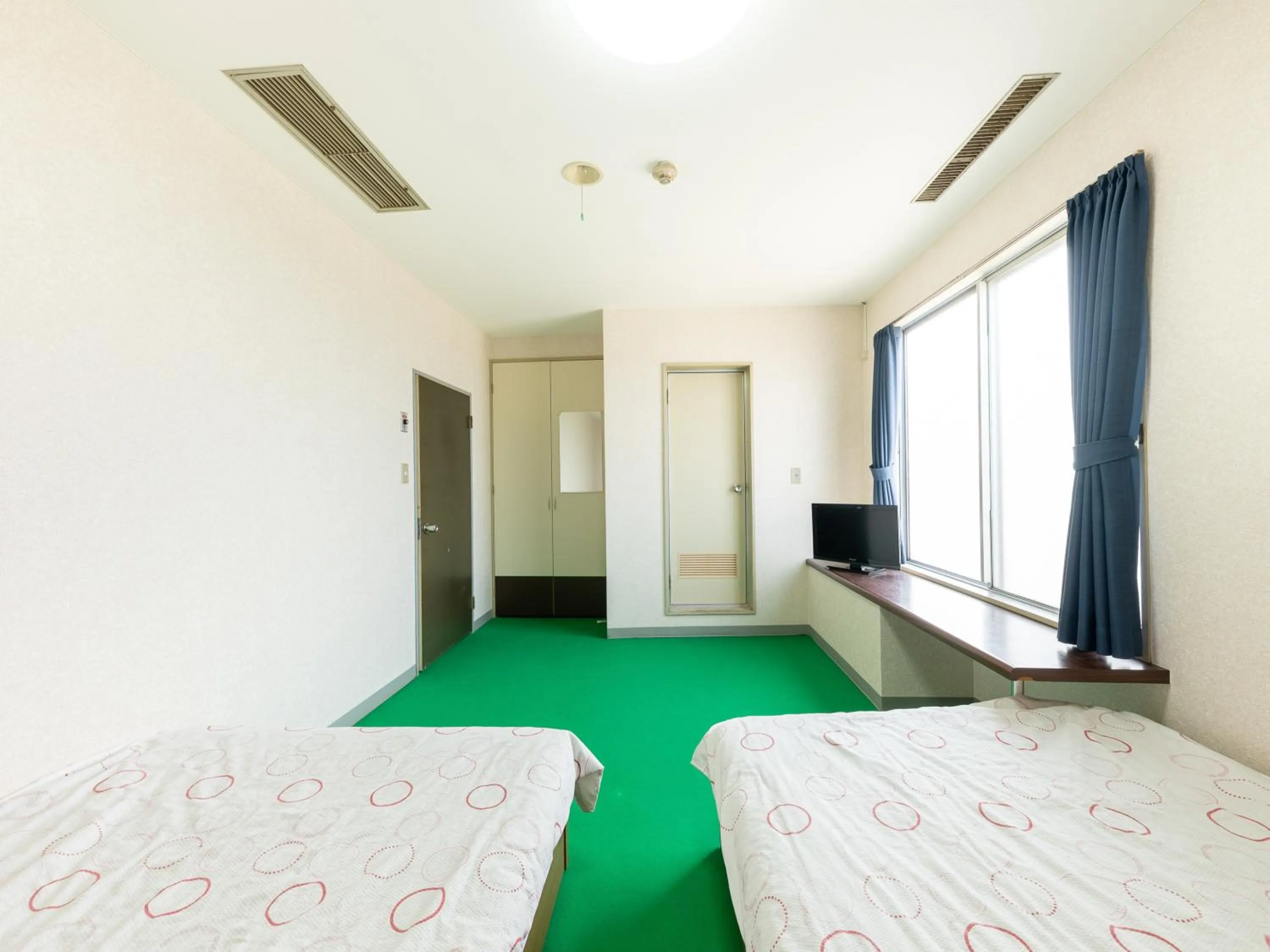 Bed in Tabist Business Hotel Chitose Kashiwazaki