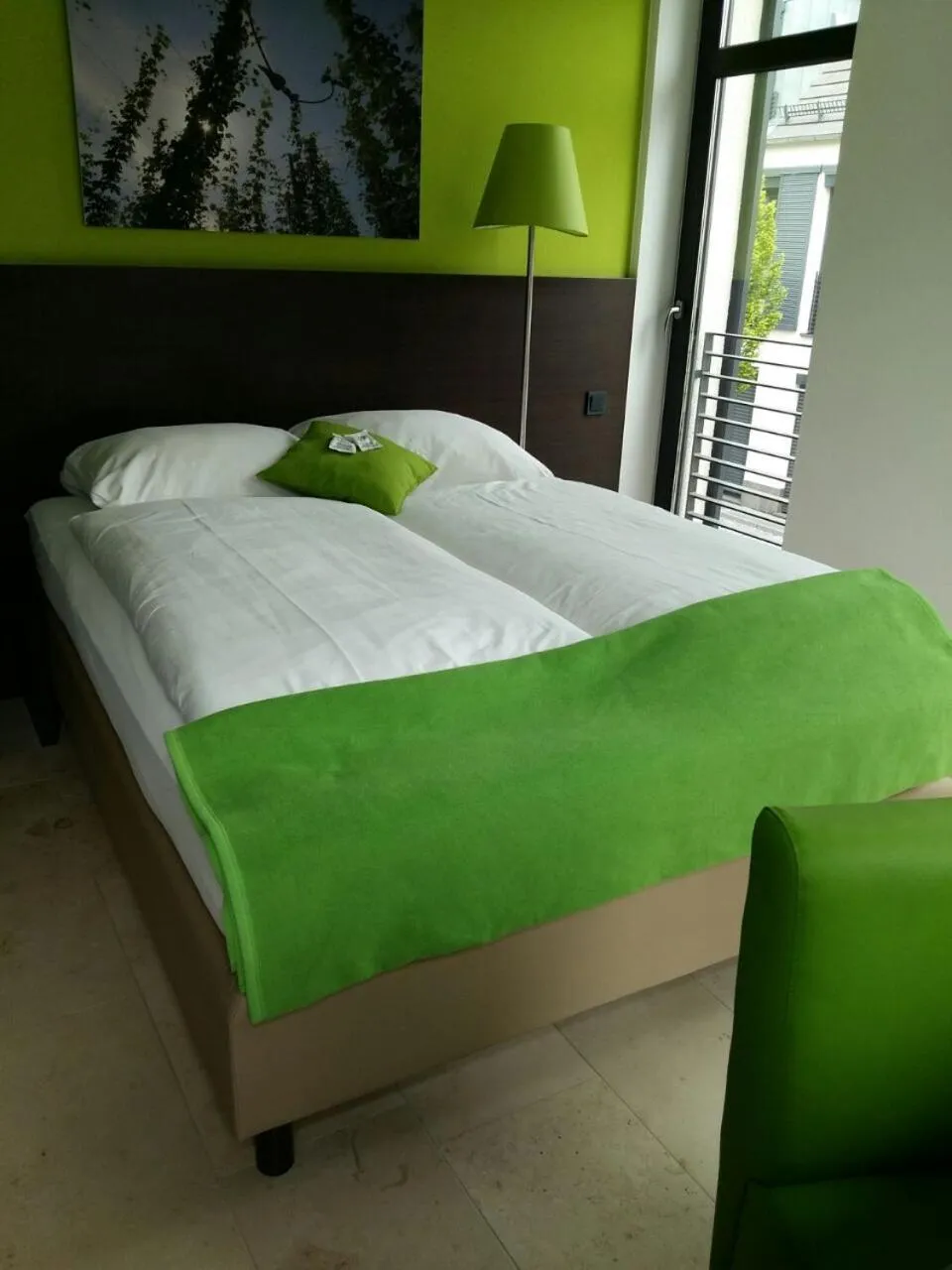 Bed in KH Hotel mit Restaurant