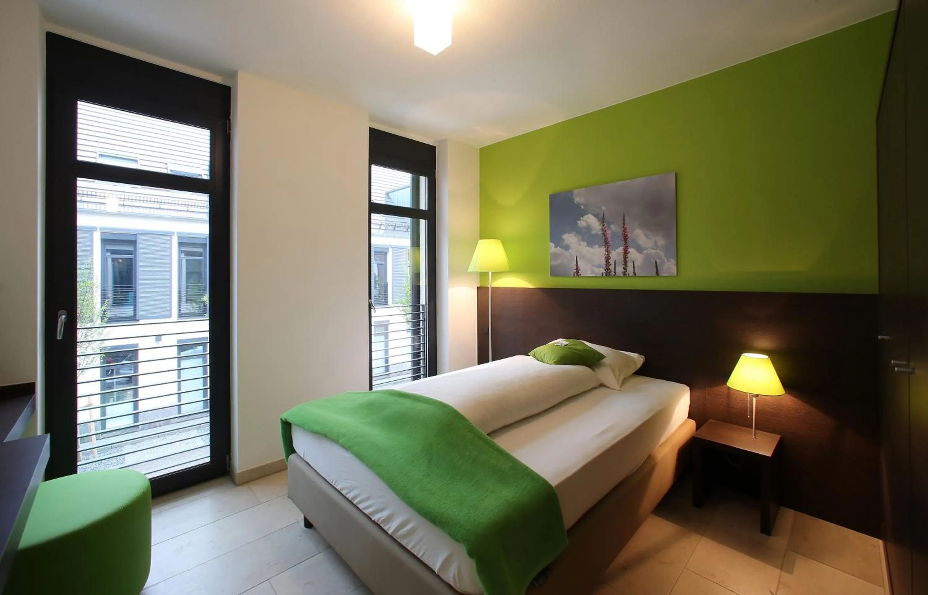 Bed in KH Hotel mit Restaurant