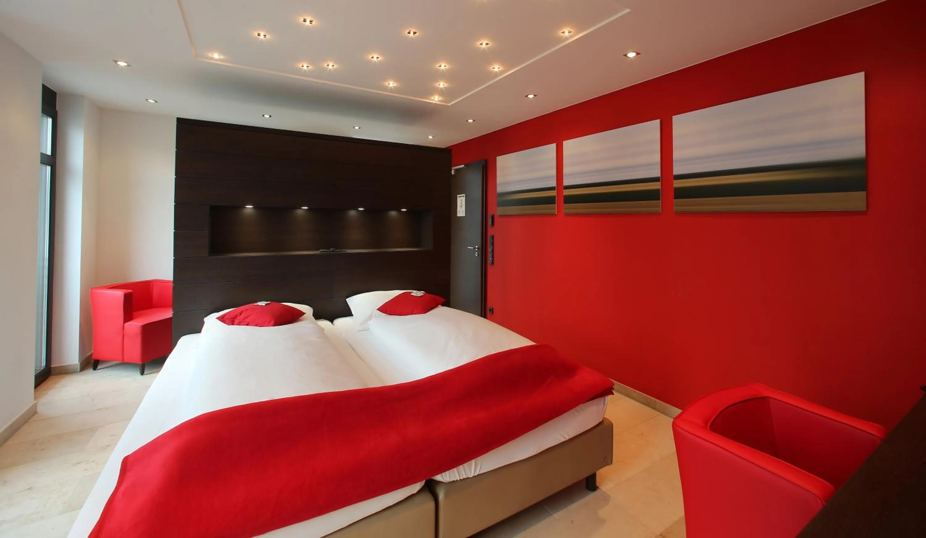 Bed in KH Hotel mit Restaurant