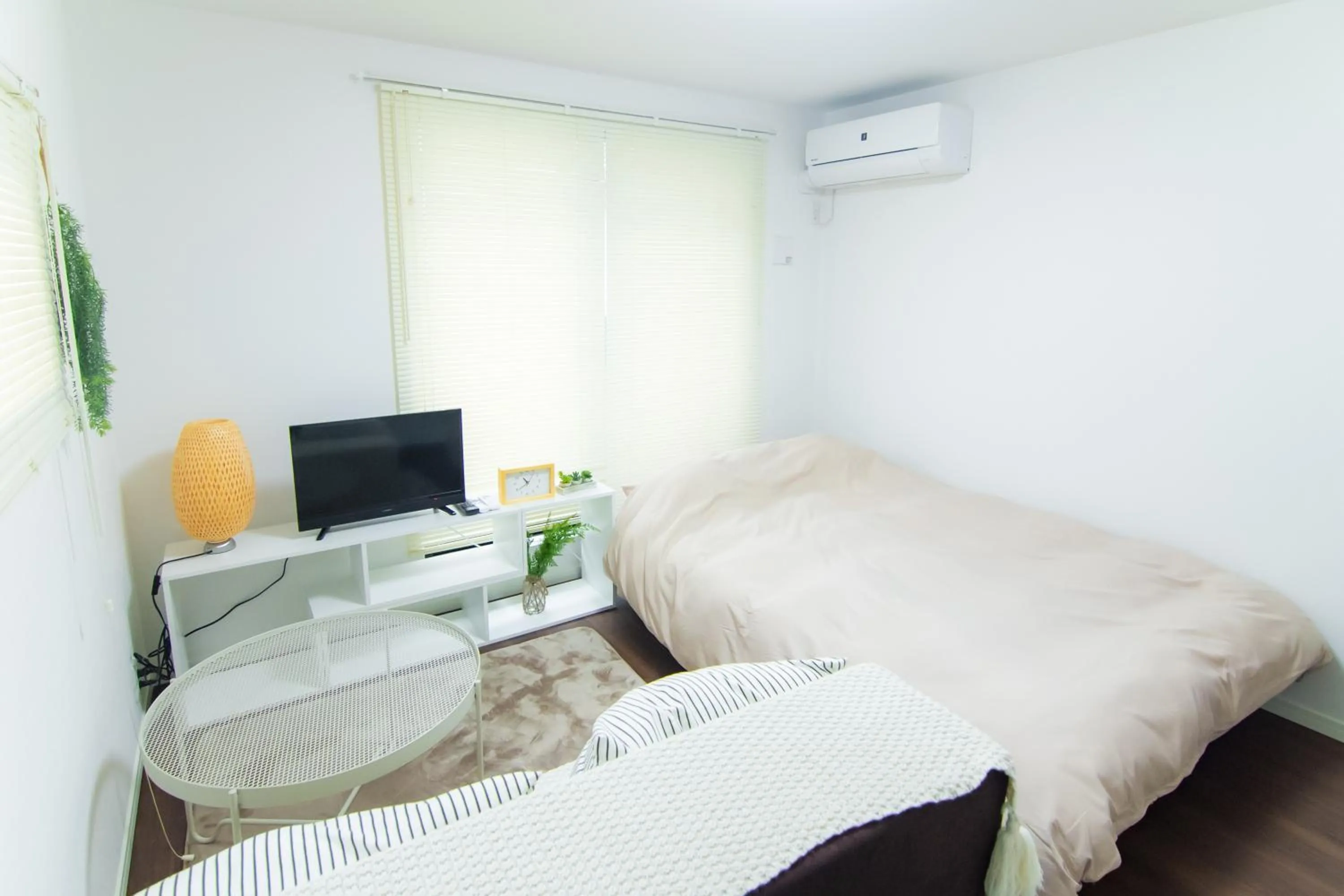 Bed in Base Hanegi Apartment by Tranova