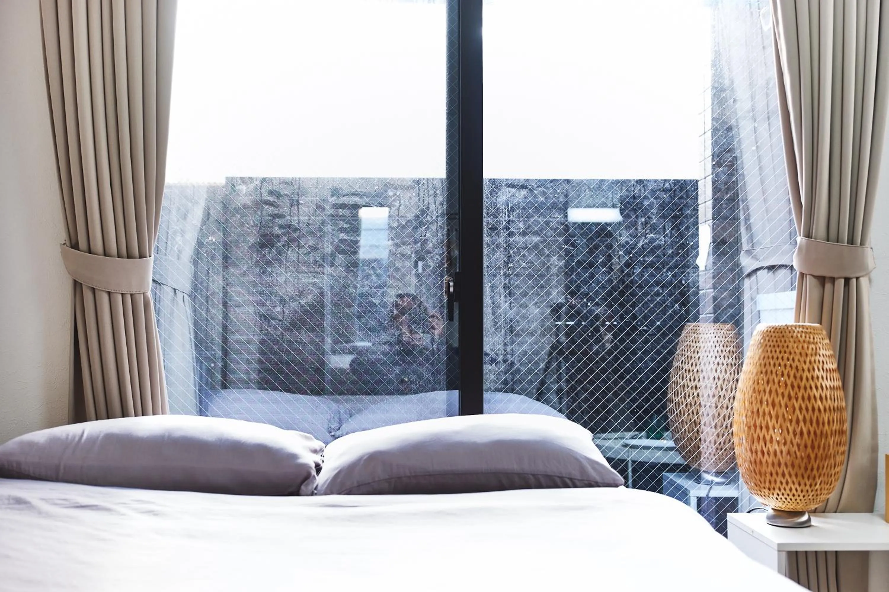 Bed in Base Hanegi Apartment by Tranova