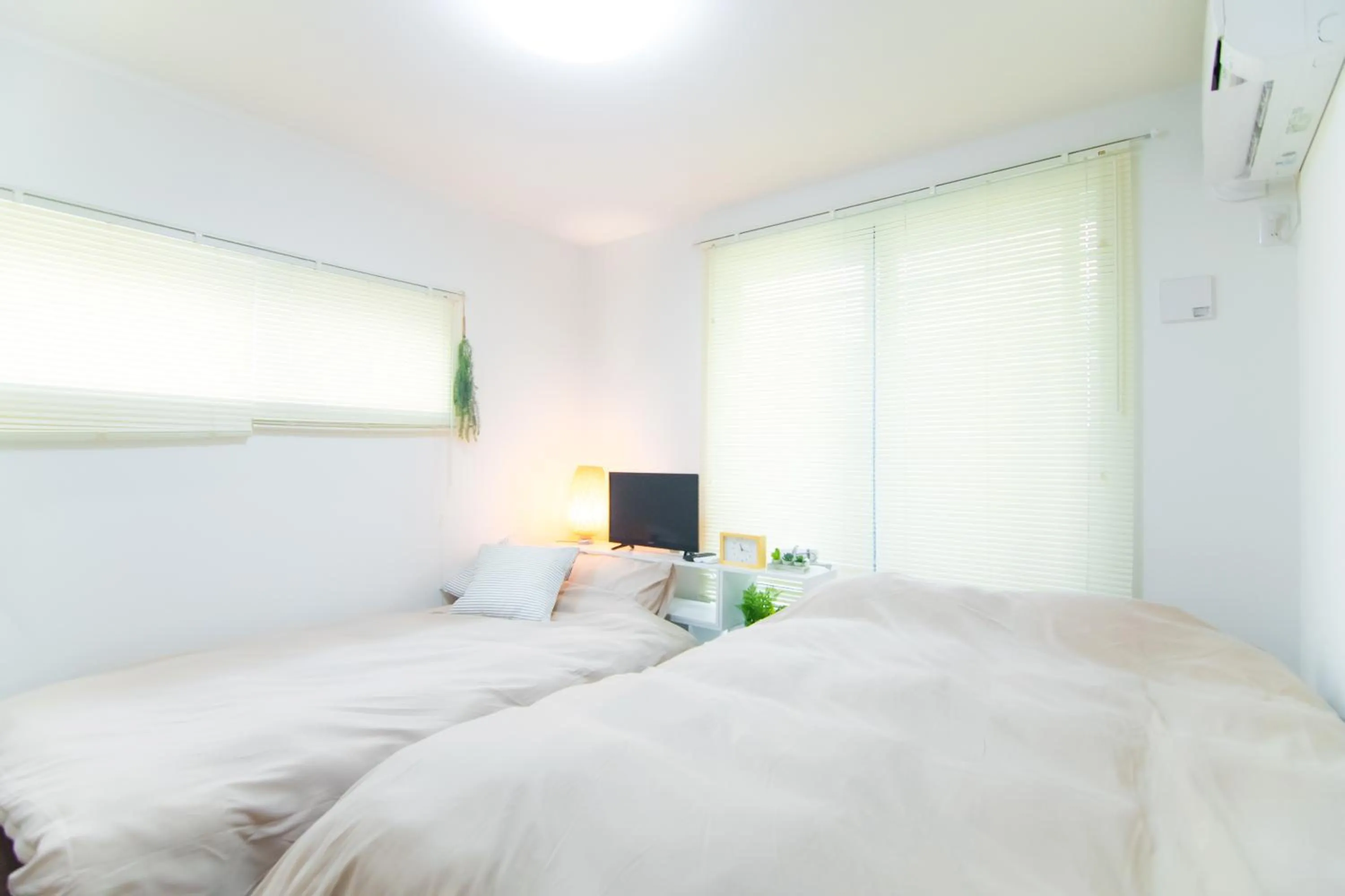 Bed in Base Hanegi Apartment by Tranova