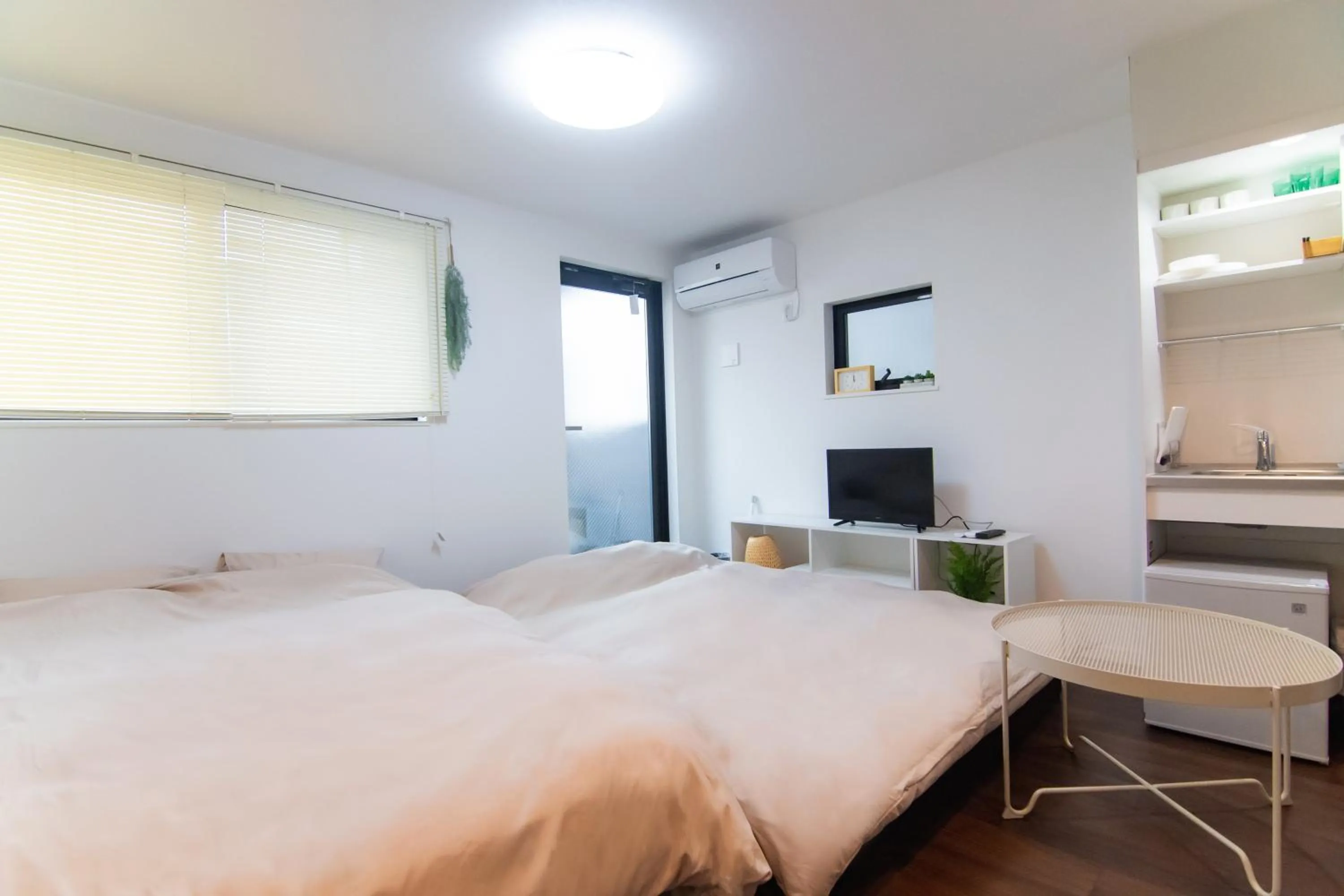 Bed in Base Hanegi Apartment by Tranova