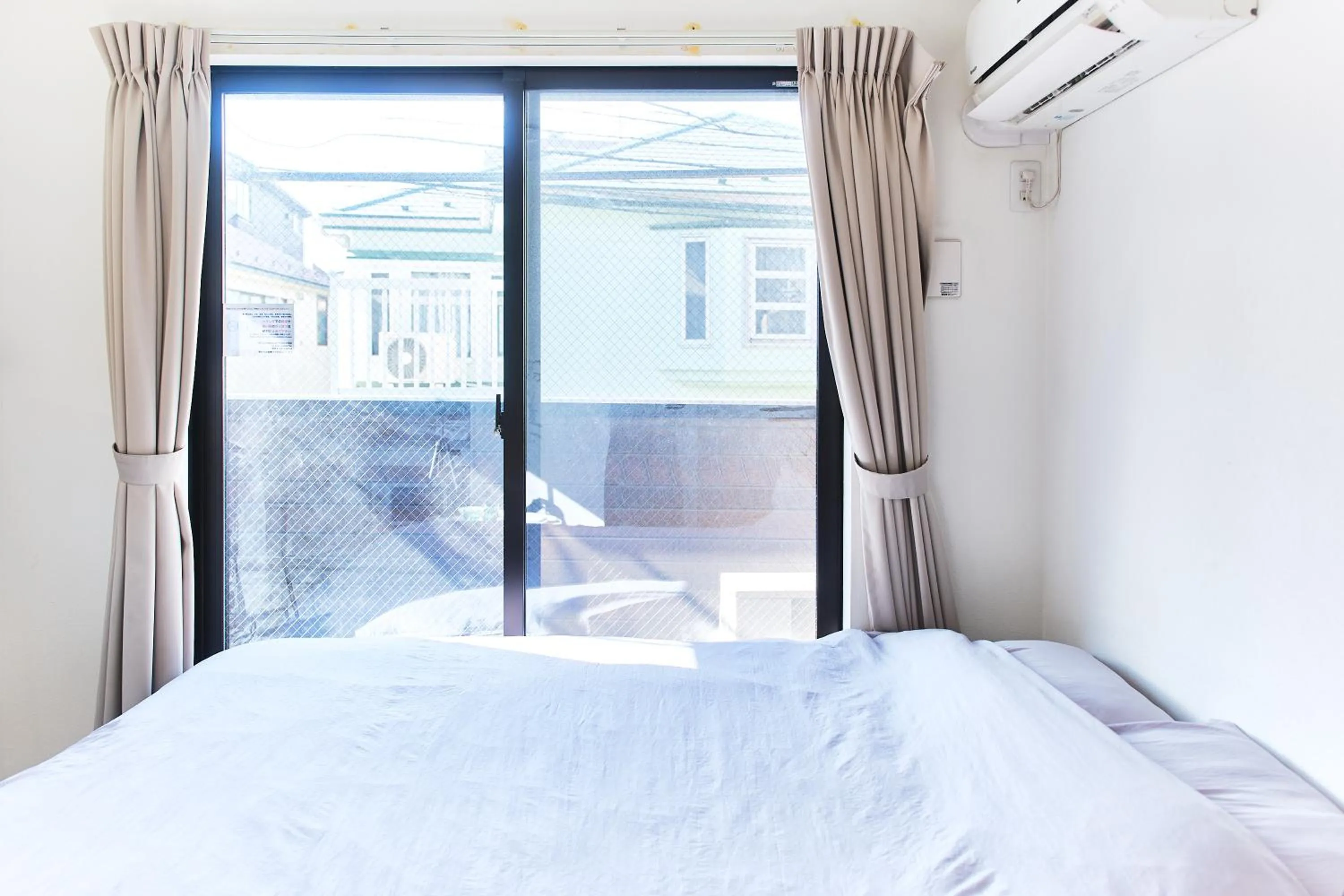 Bed in Base Hanegi Apartment by Tranova