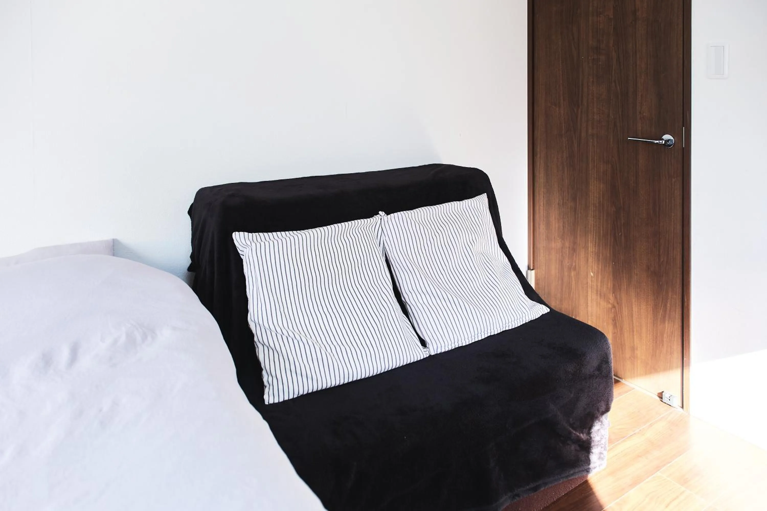 Bed in Base Hanegi Apartment by Tranova