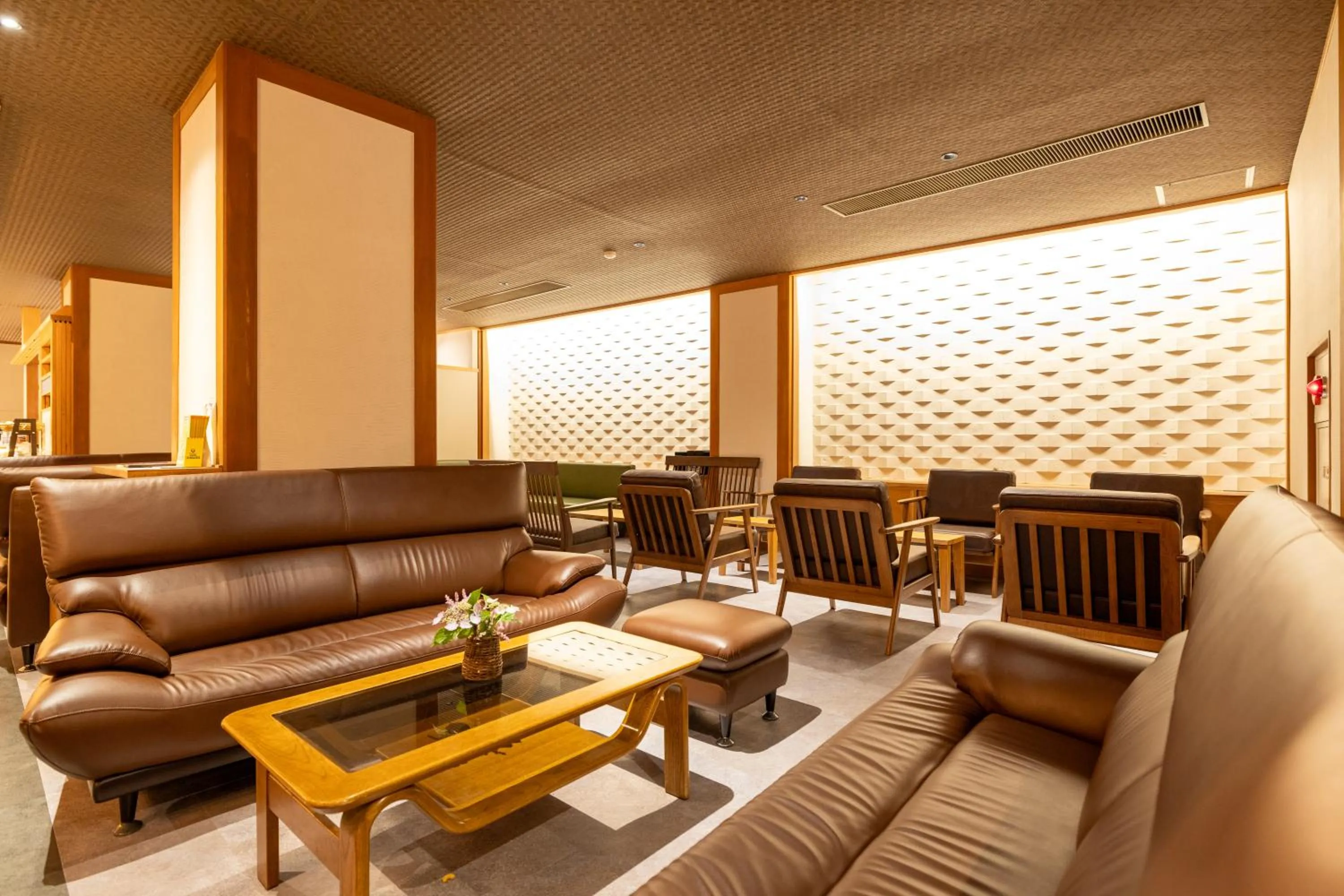 Communal lounge/ TV room in Yorokobinoyado Takamatsu