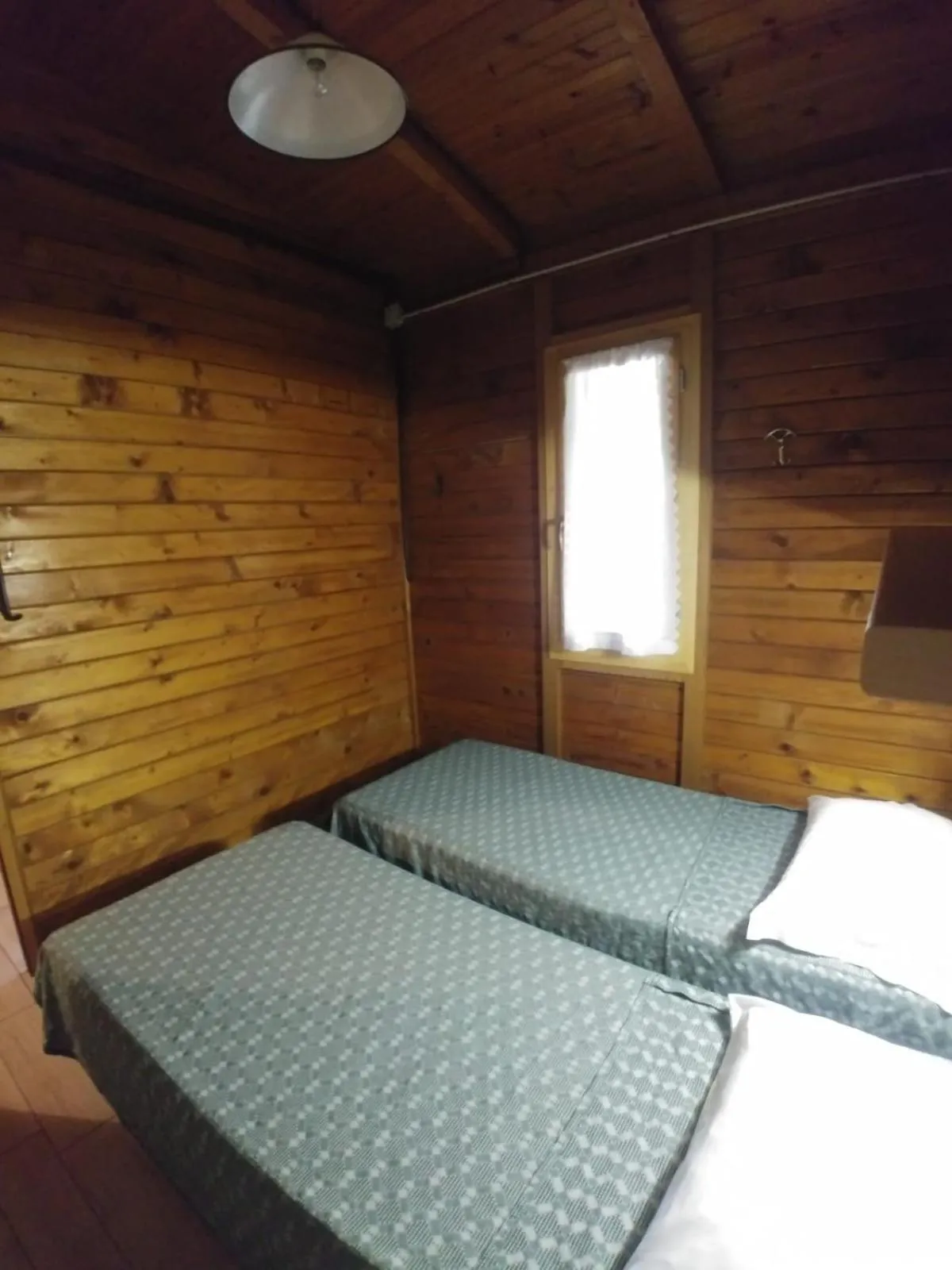 Photo of the whole room, Bed in Villaggio Samoa