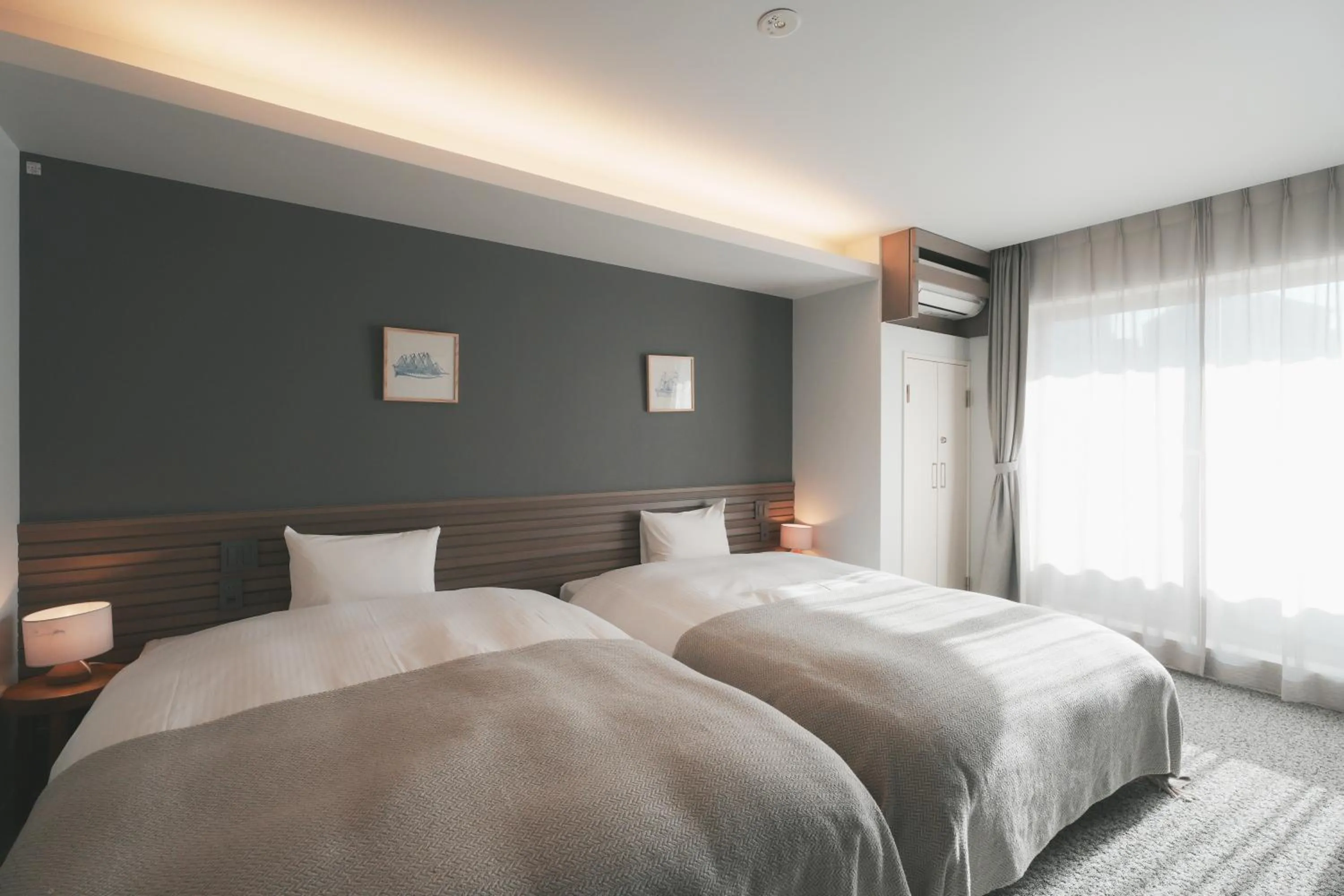 Bed in LAZULI Hiroshima Hotel and Lounge