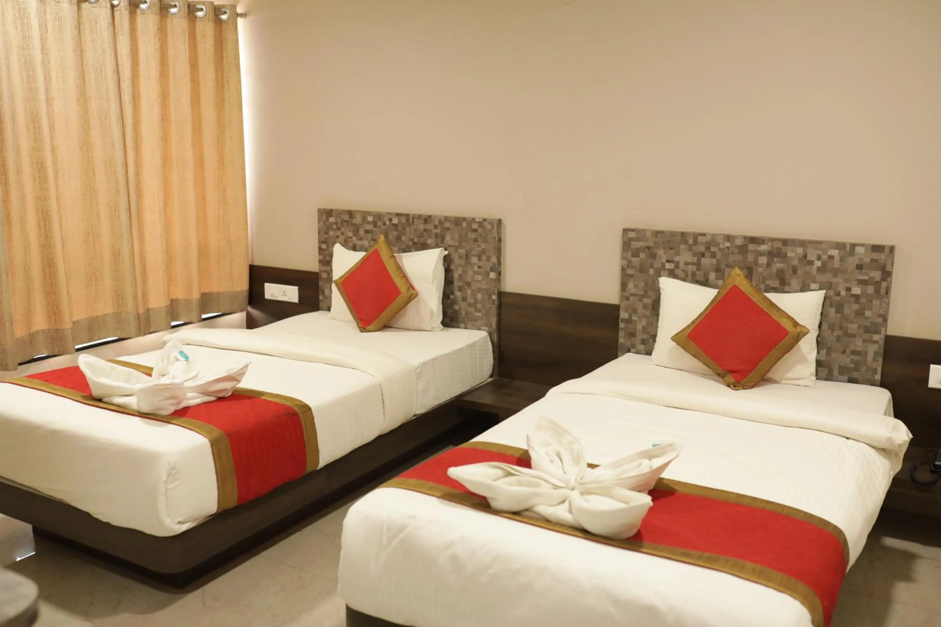 Bed in Hotel Rahul Palace Belgaum