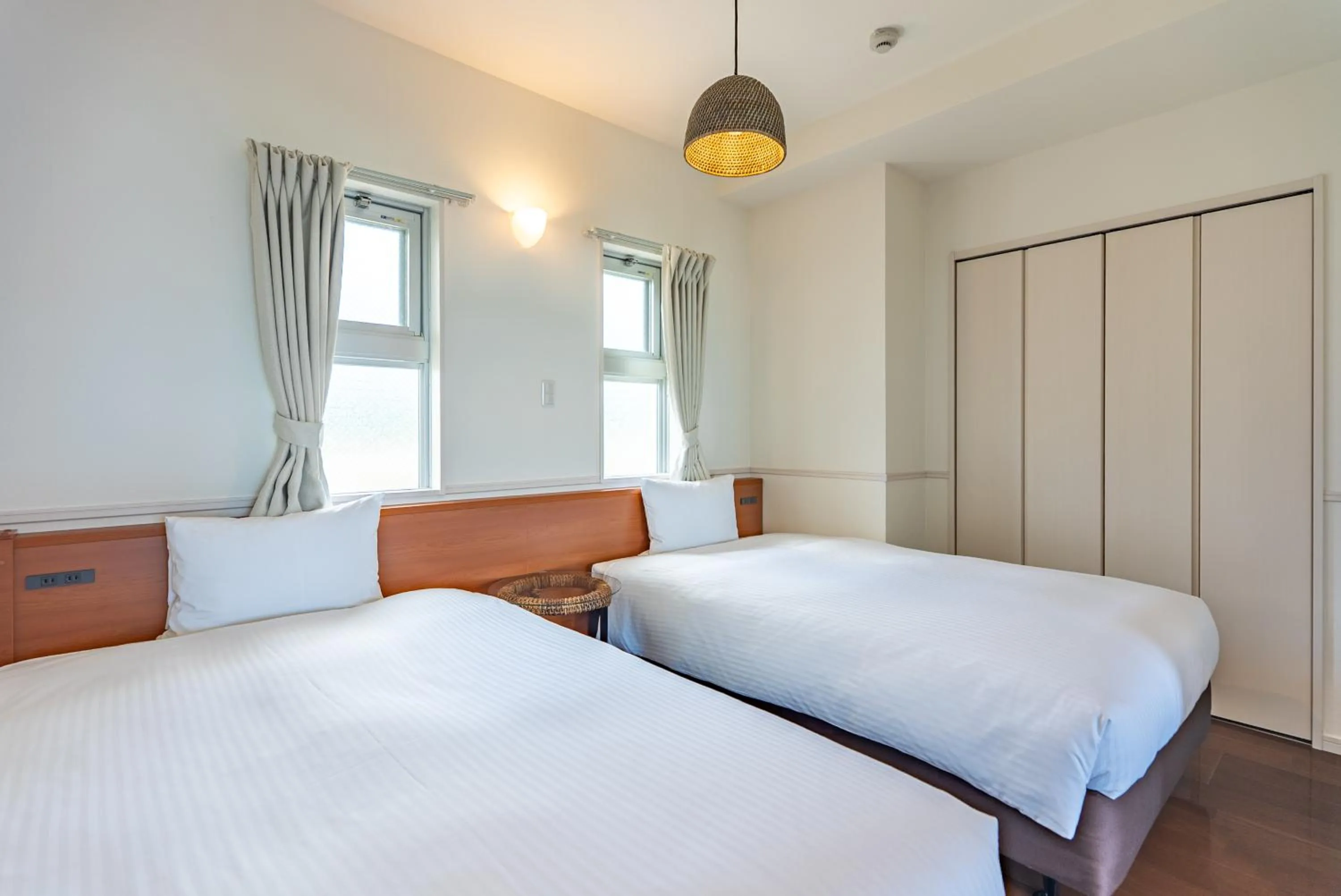 Bed in Odysis Onna Resort Hotel