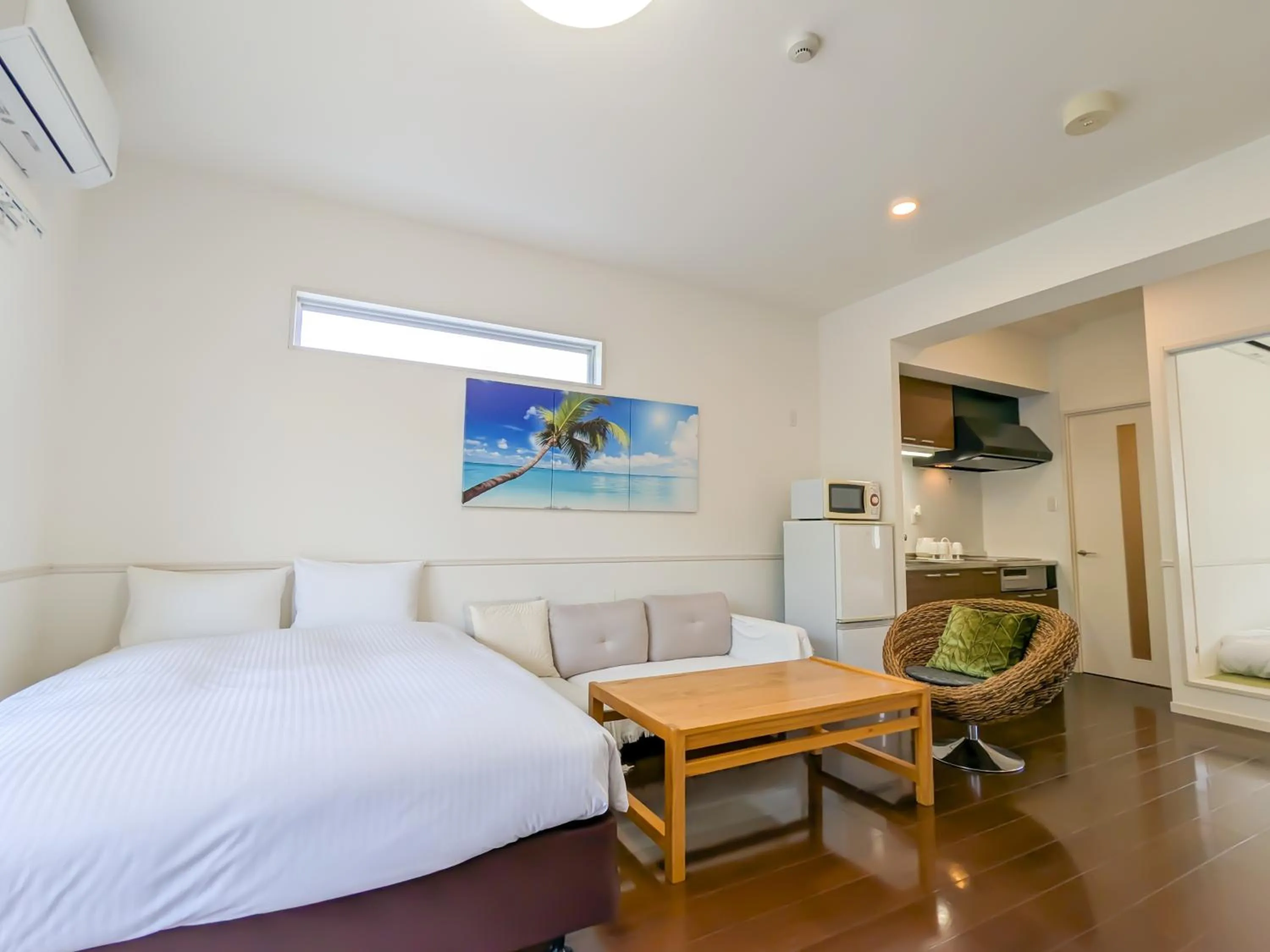 Bed in Odysis Onna Resort Hotel