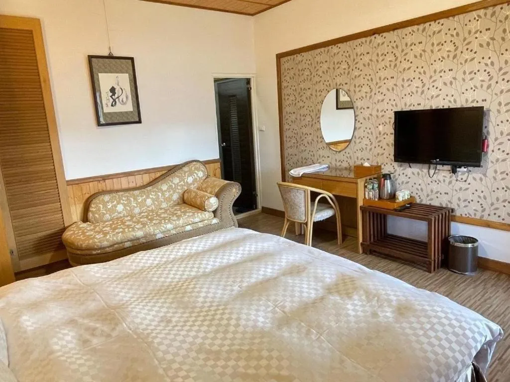 Bed in Dragon Manor Resort