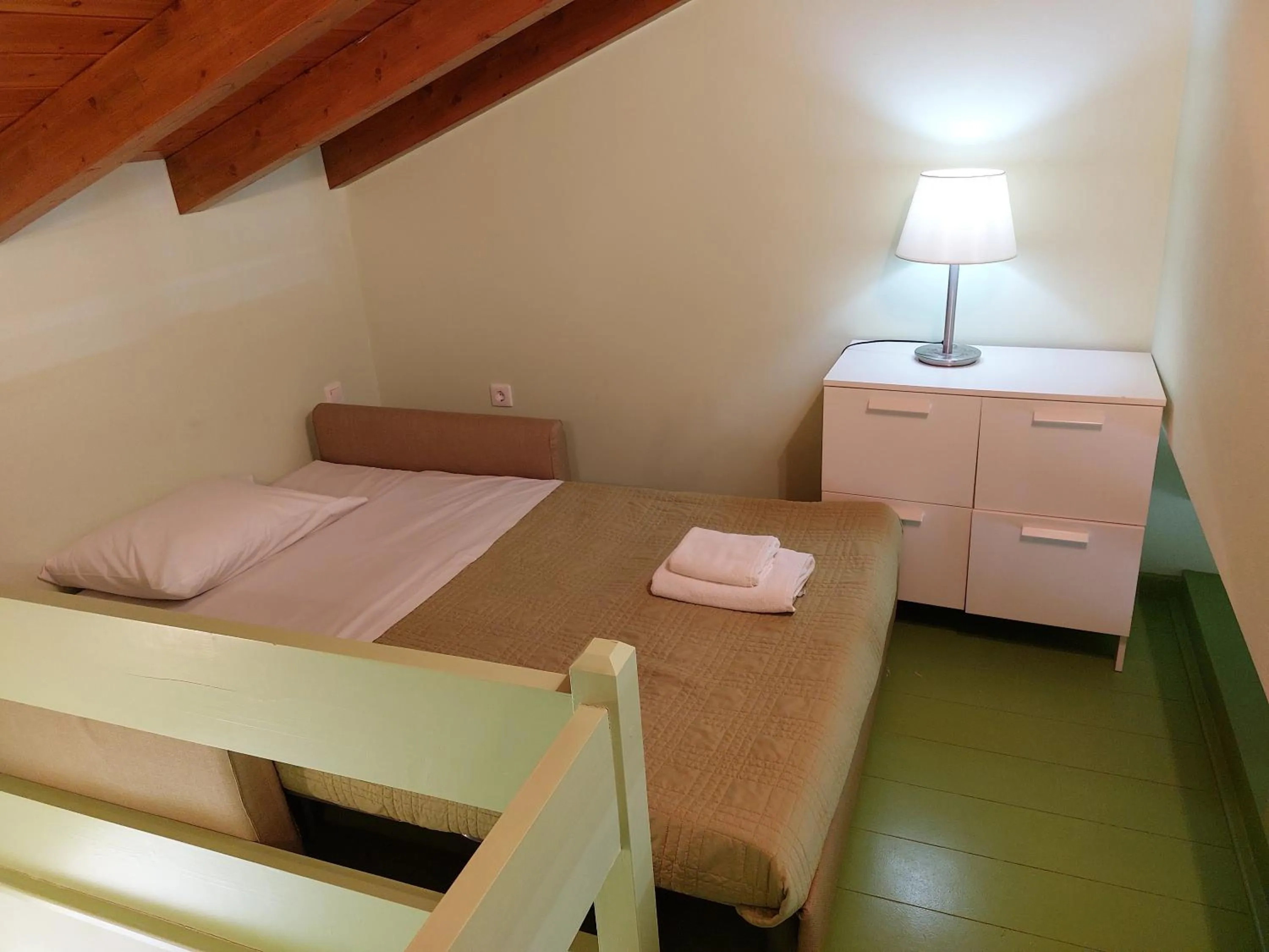 Bed in PLEIADES lUXURY APARTMENTS