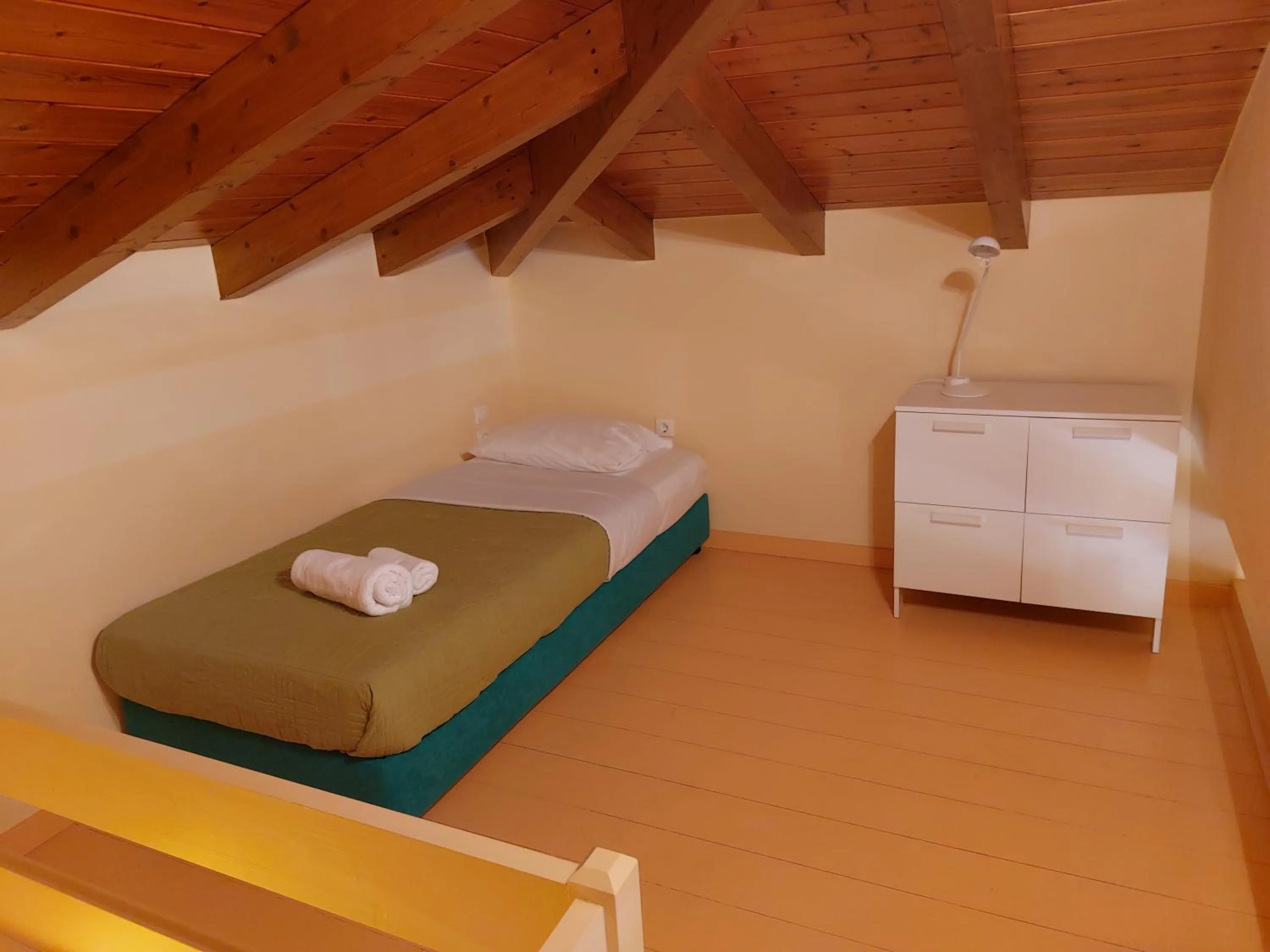 Bed in PLEIADES lUXURY APARTMENTS