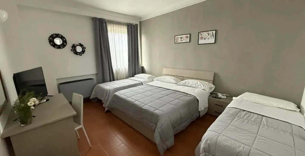Bed in HOTEL QUADRIFOGLIO