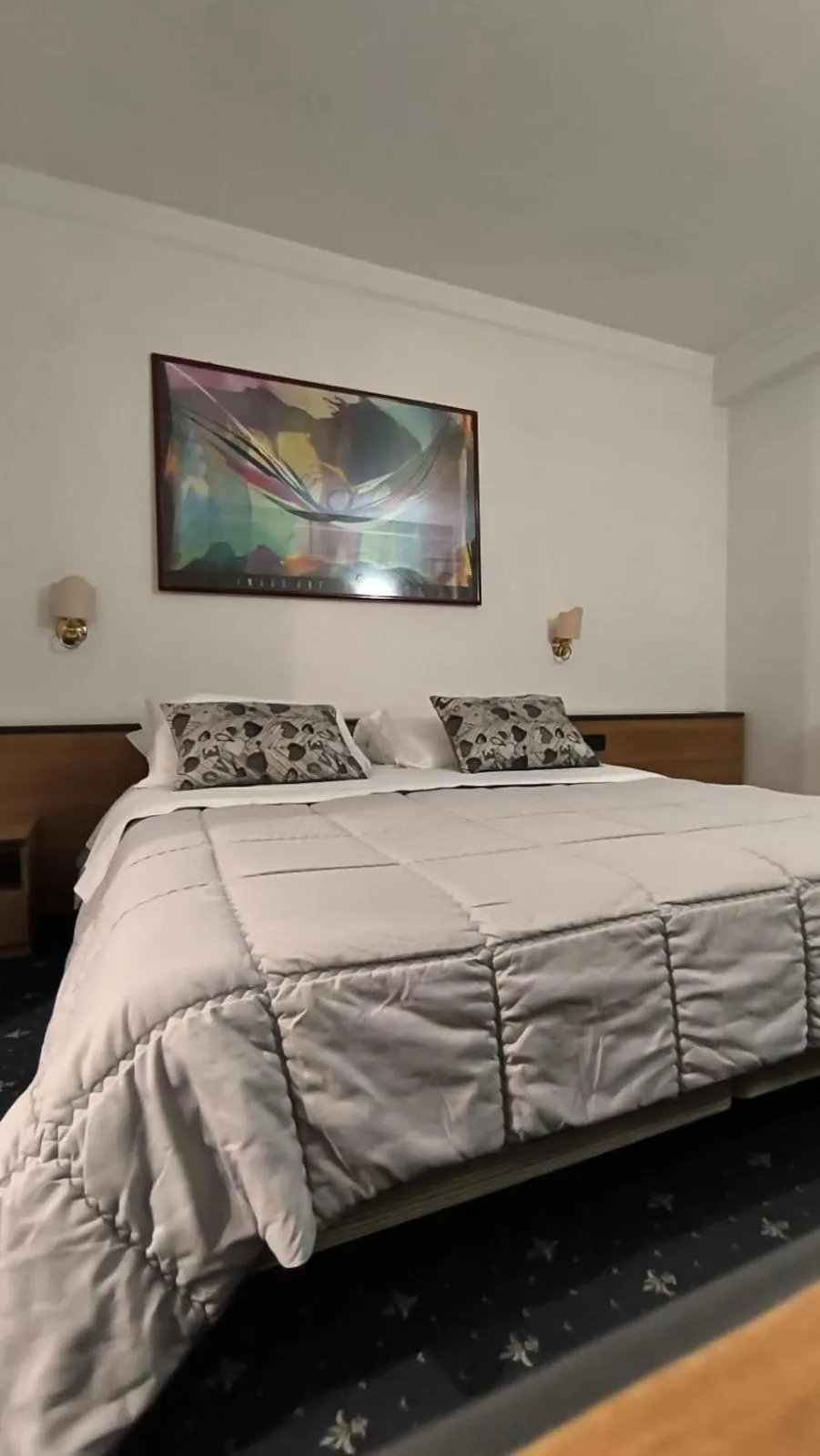 Bed in HOTEL QUADRIFOGLIO