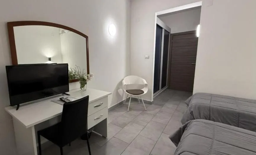 Bed in HOTEL QUADRIFOGLIO