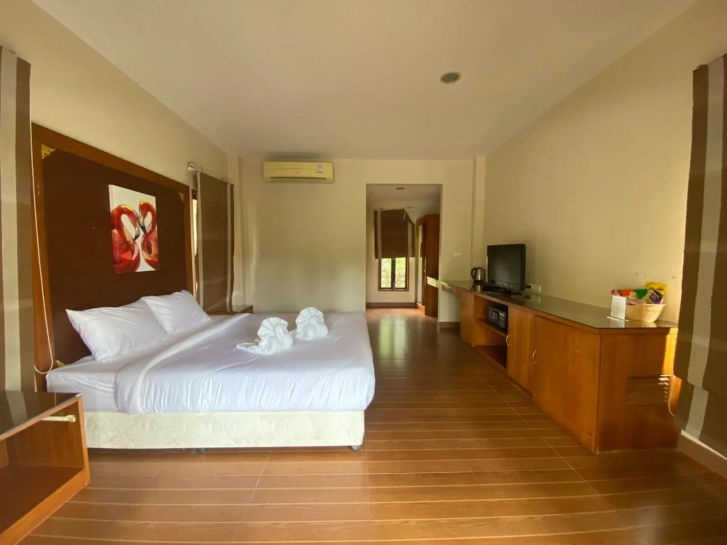 Bed in Chaithalay Khanom Resort