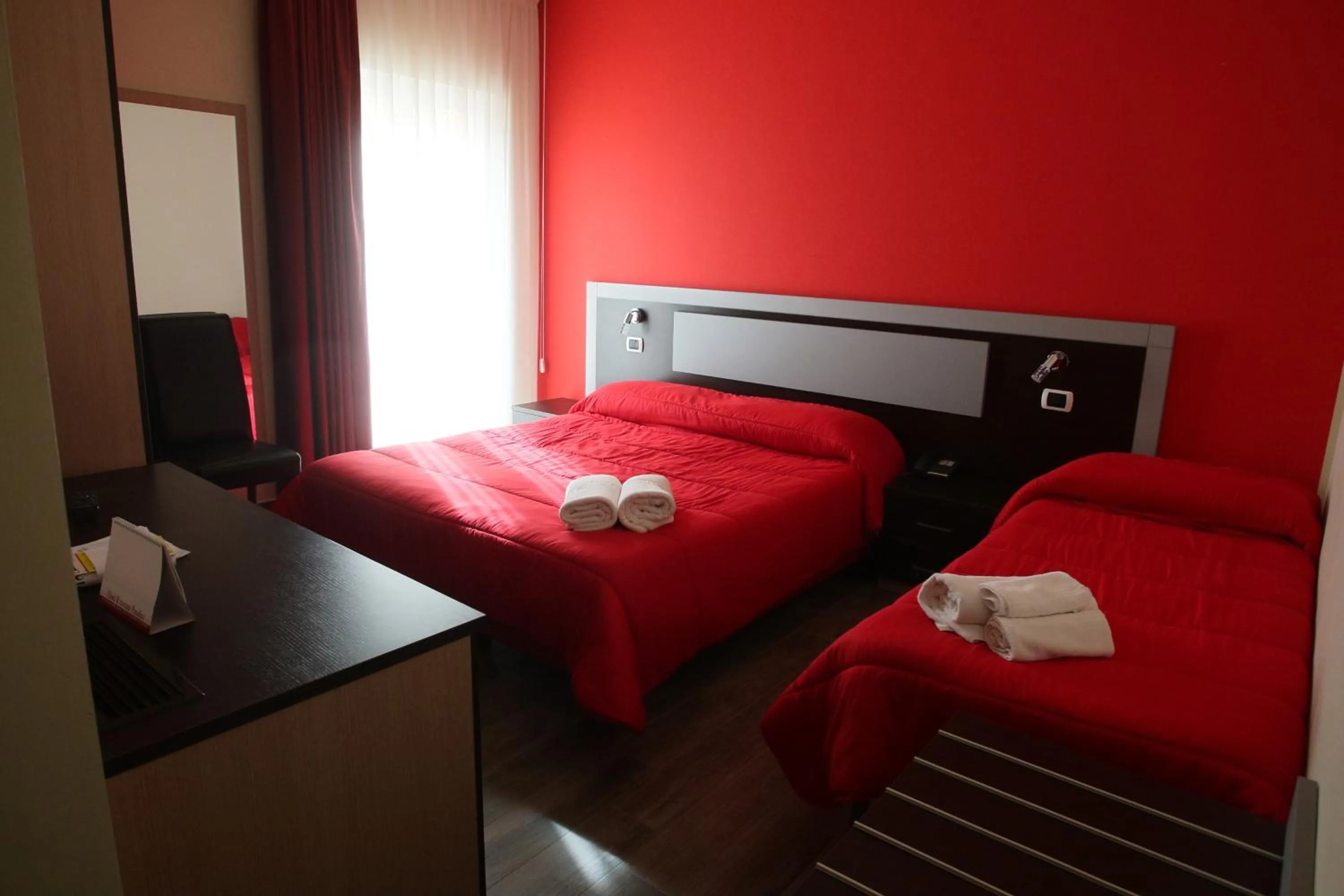 Bed in Hotel Paradiso