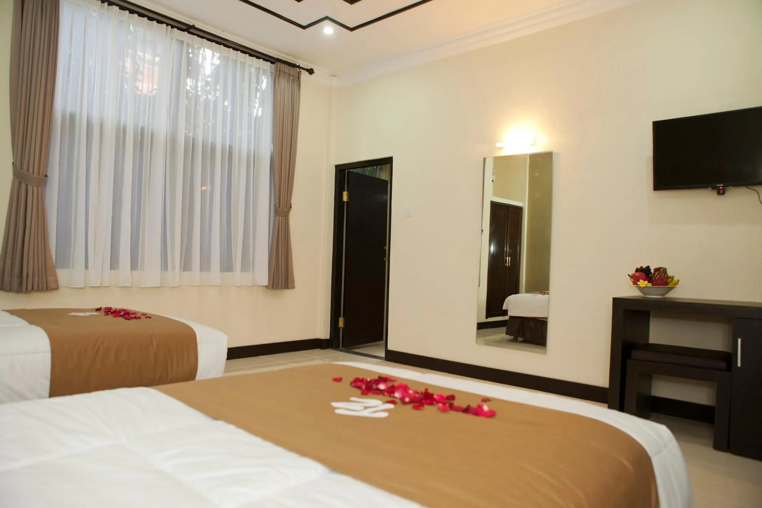 Bed in Troppo Zone Puri Rama Resort Kuta