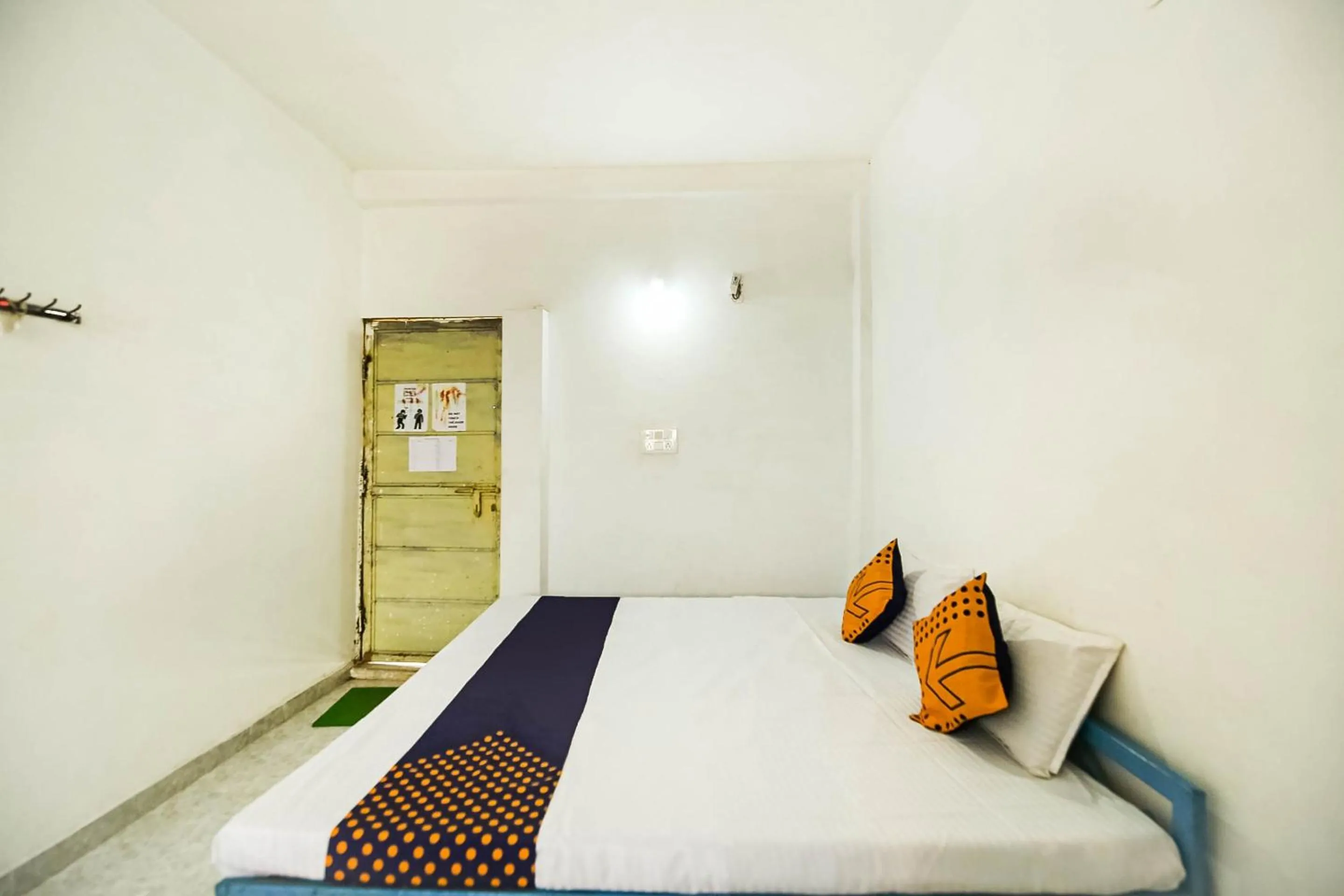 Bedroom, Bed in SPOT ON by OYO Krishna Market And Lodge