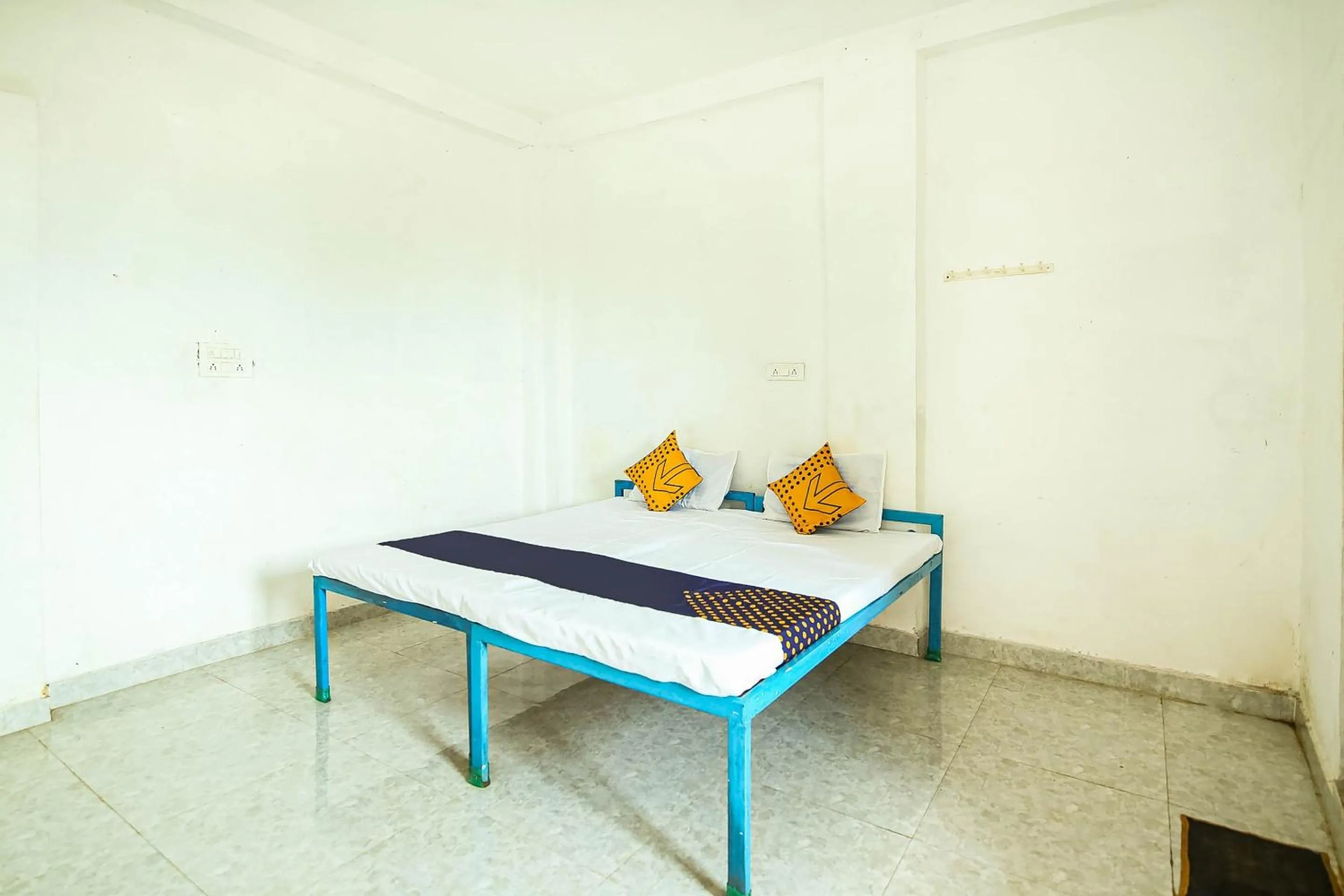 Bedroom in SPOT ON by OYO Krishna Market And Lodge