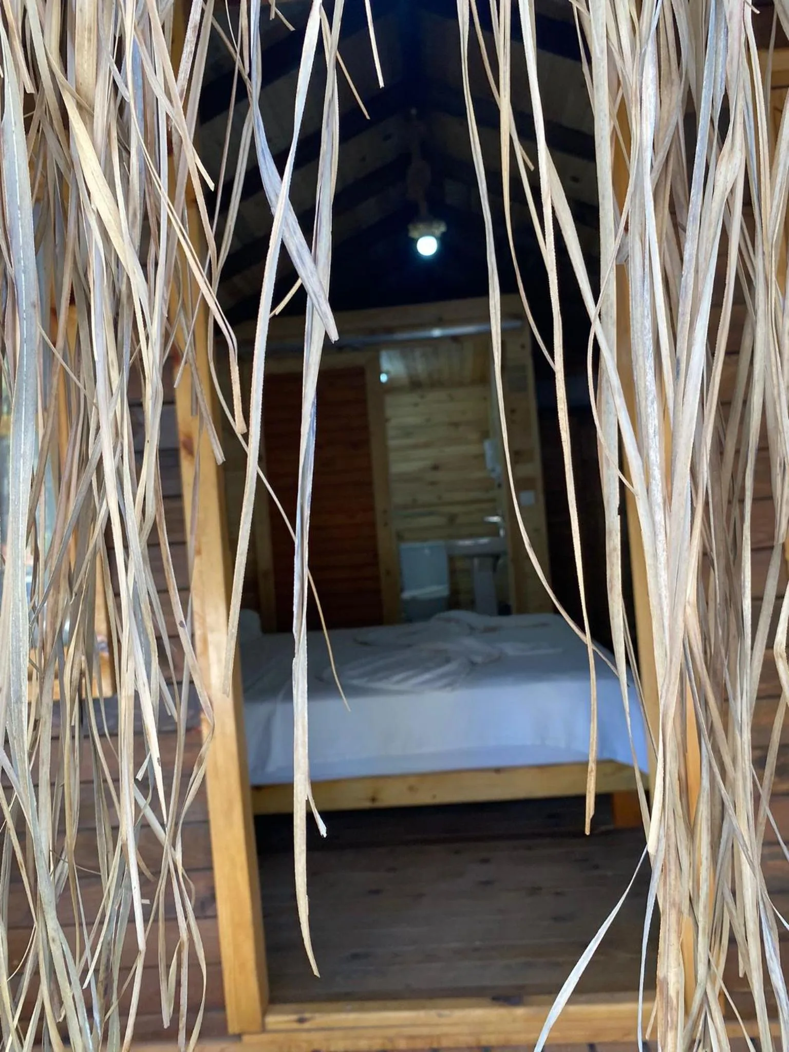 Bed in Green Pine Bungalows & Beach Luxury Concept