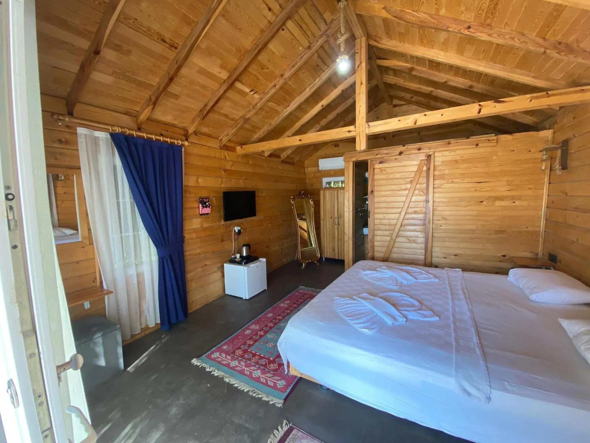 Bed in Green Pine Bungalows & Beach Luxury Concept