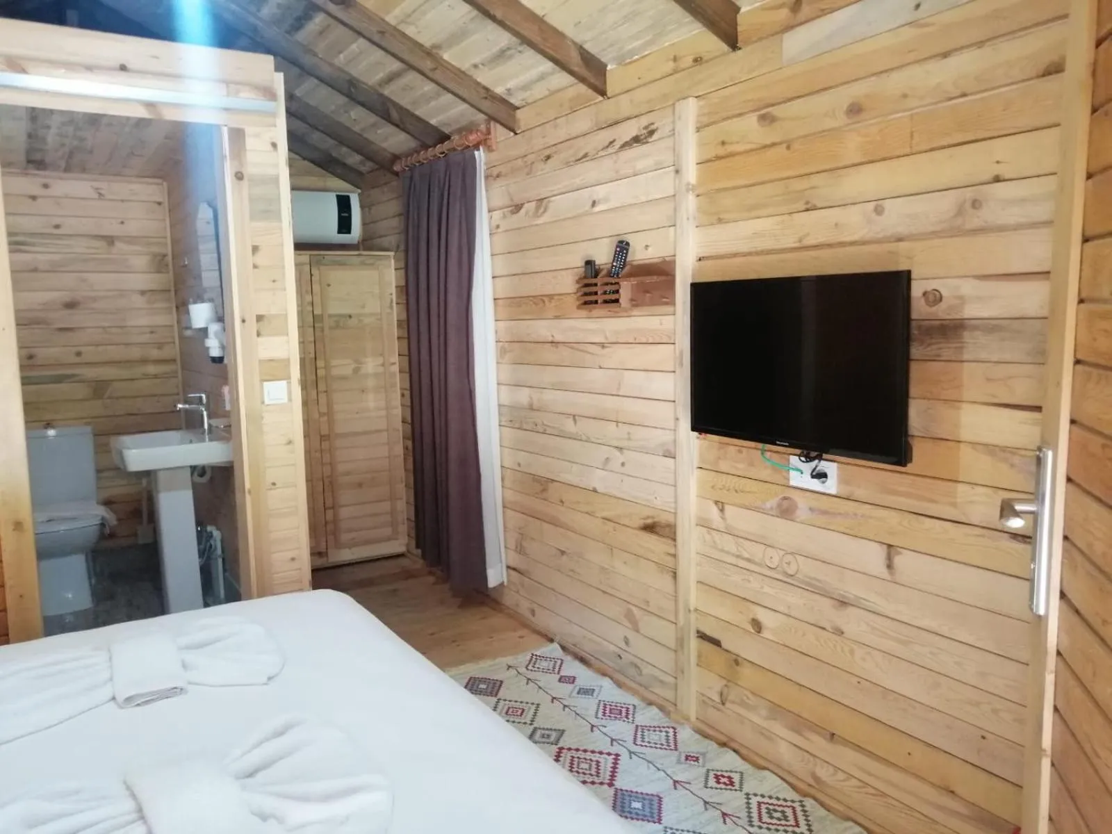 Bed in Green Pine Bungalows & Beach Luxury Concept