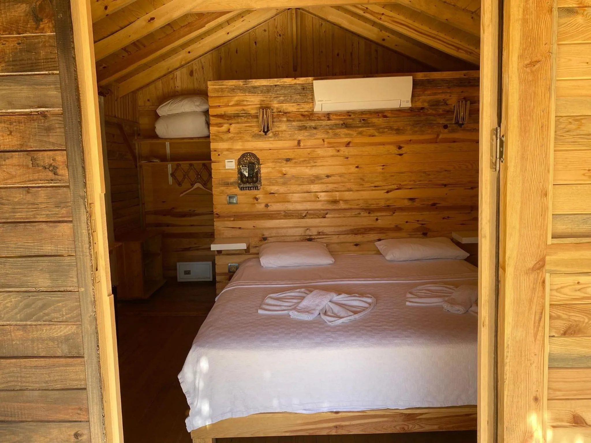 Bed in Green Pine Bungalows & Beach Luxury Concept