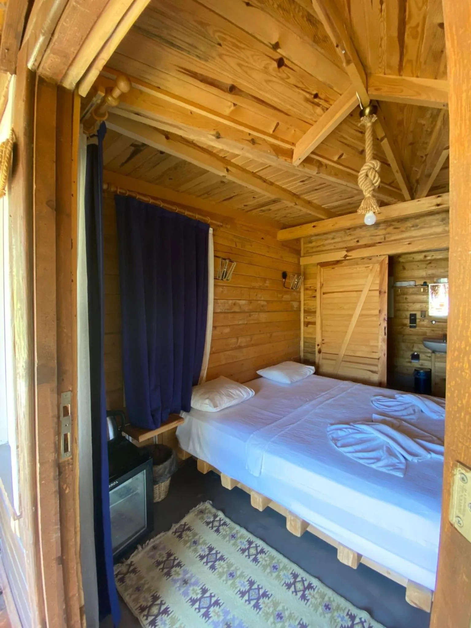 Bed in Green Pine Bungalows & Beach Luxury Concept