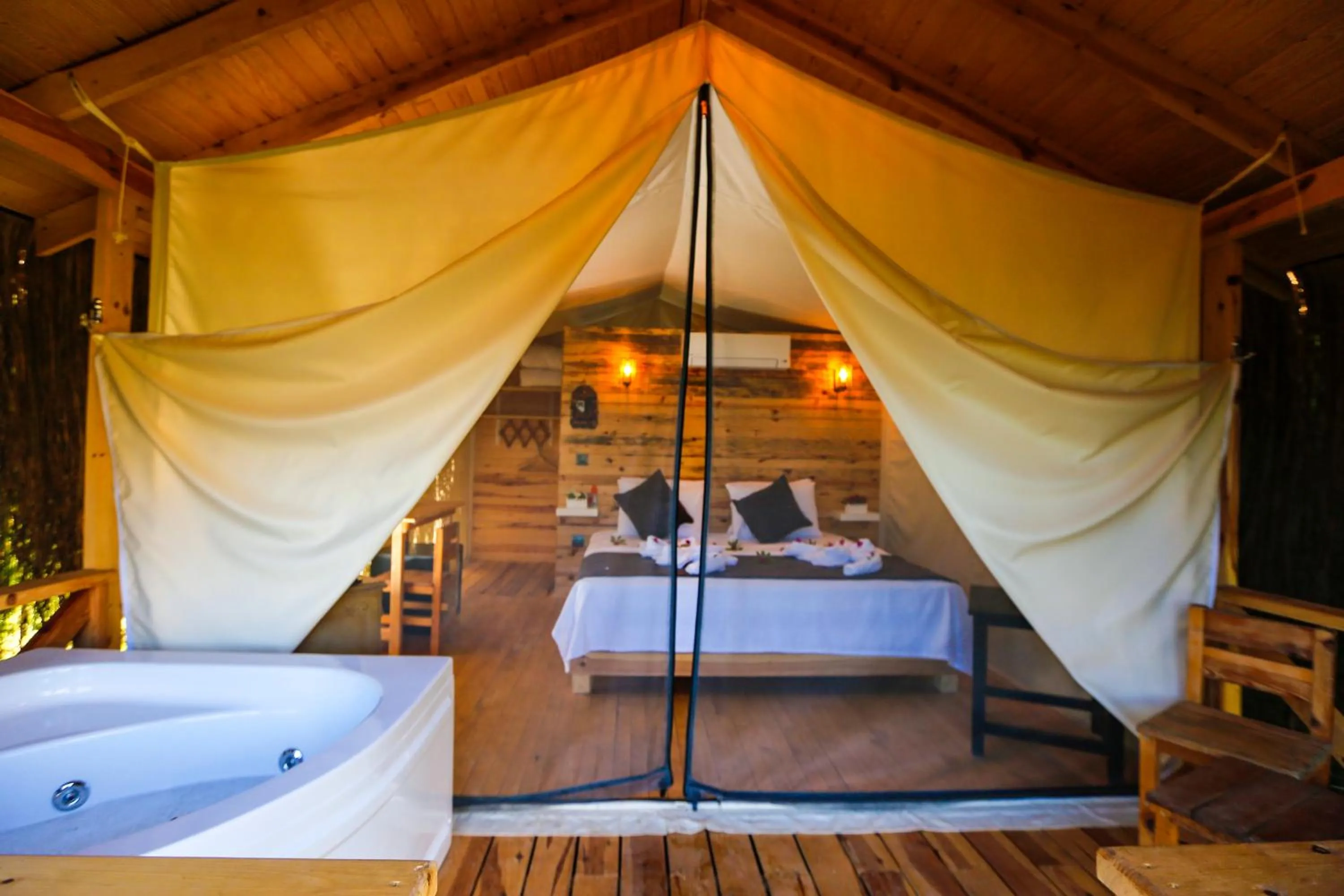 Bed in Green Pine Bungalows & Beach Luxury Concept