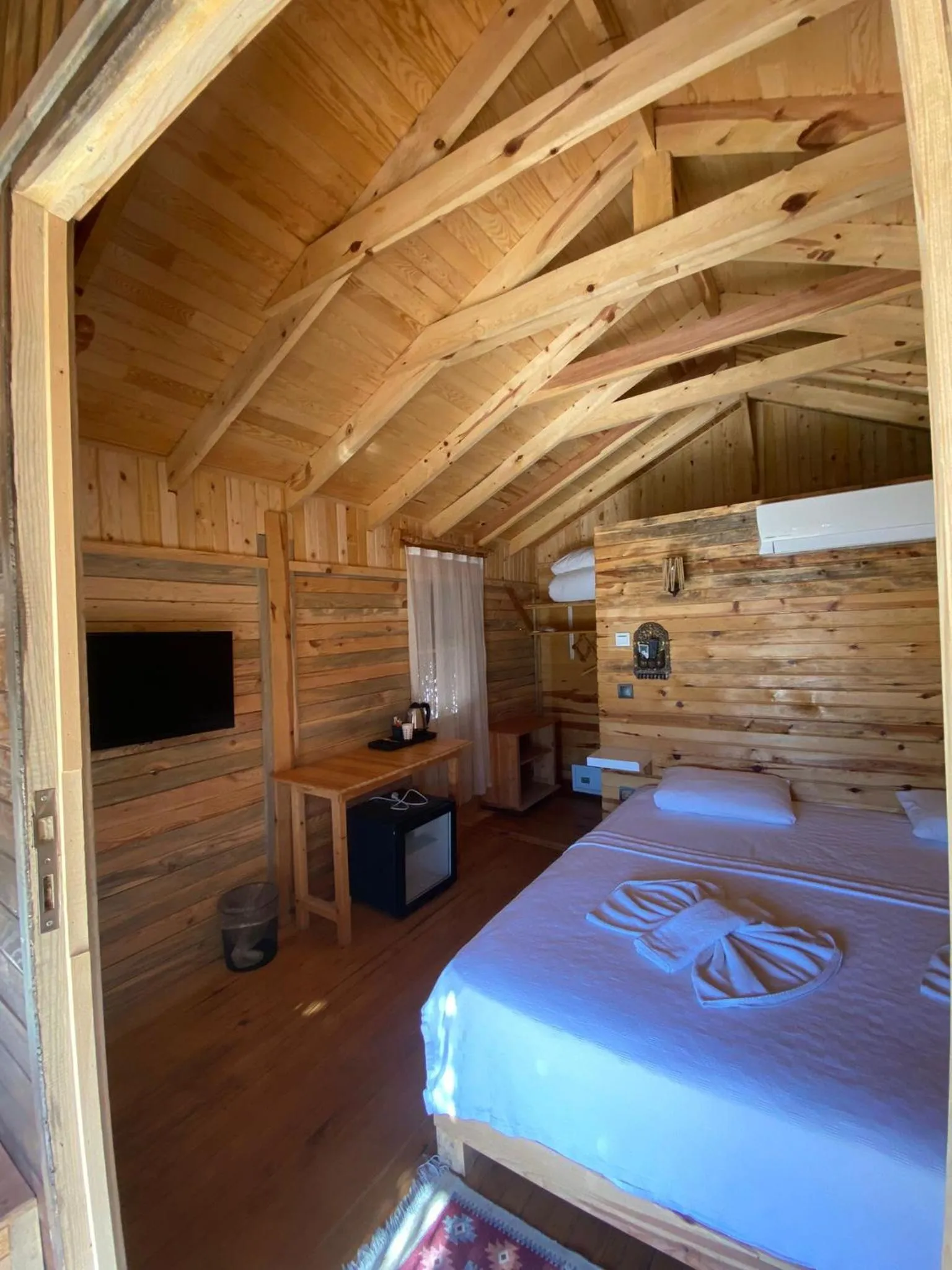 Bed in Green Pine Bungalows & Beach Luxury Concept