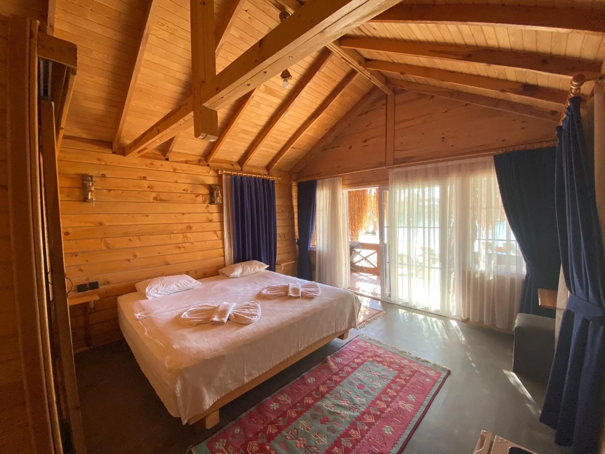 Bed in Green Pine Bungalows & Beach Luxury Concept