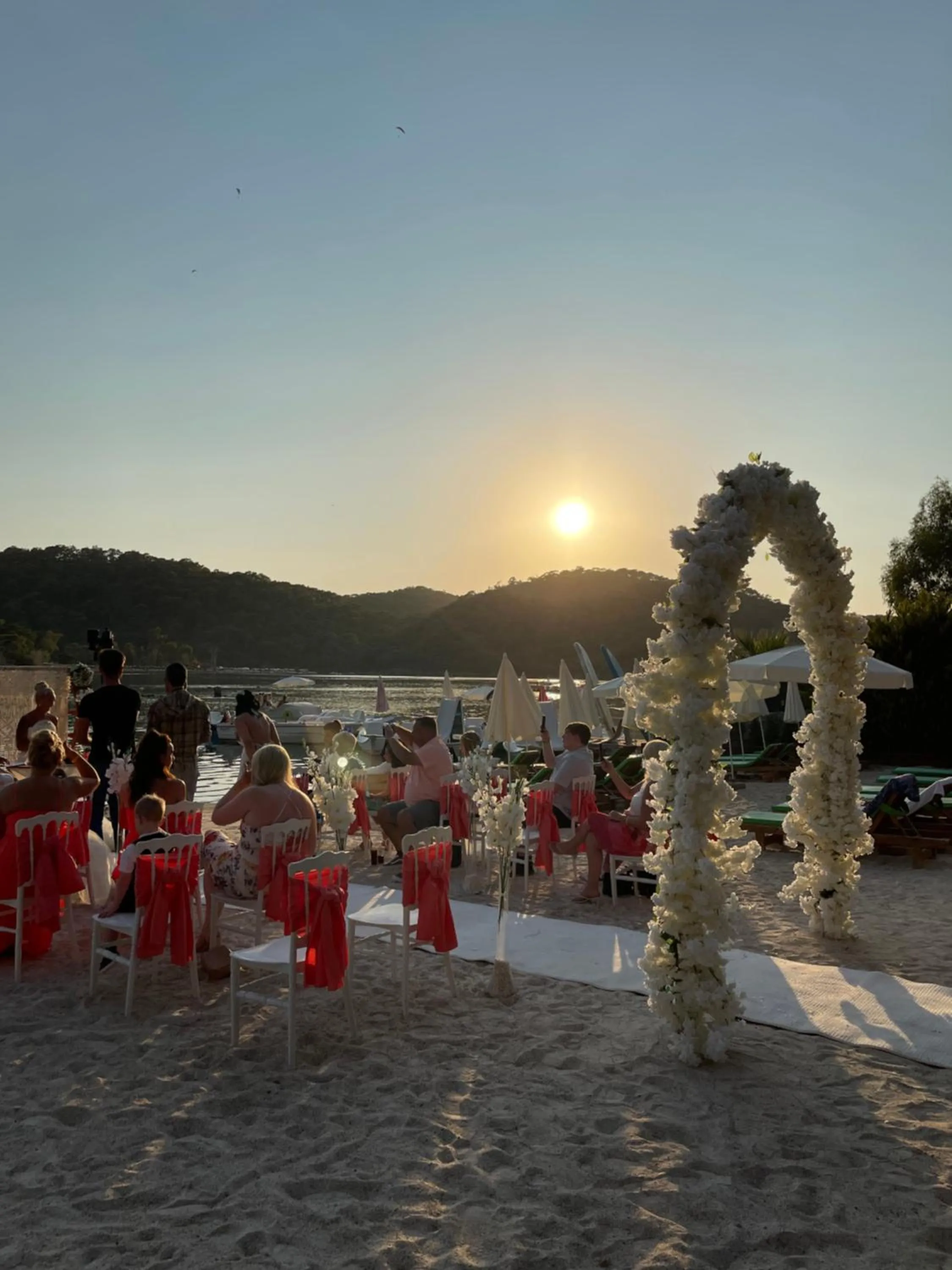 People in Green Pine Bungalows & Beach Luxury Concept