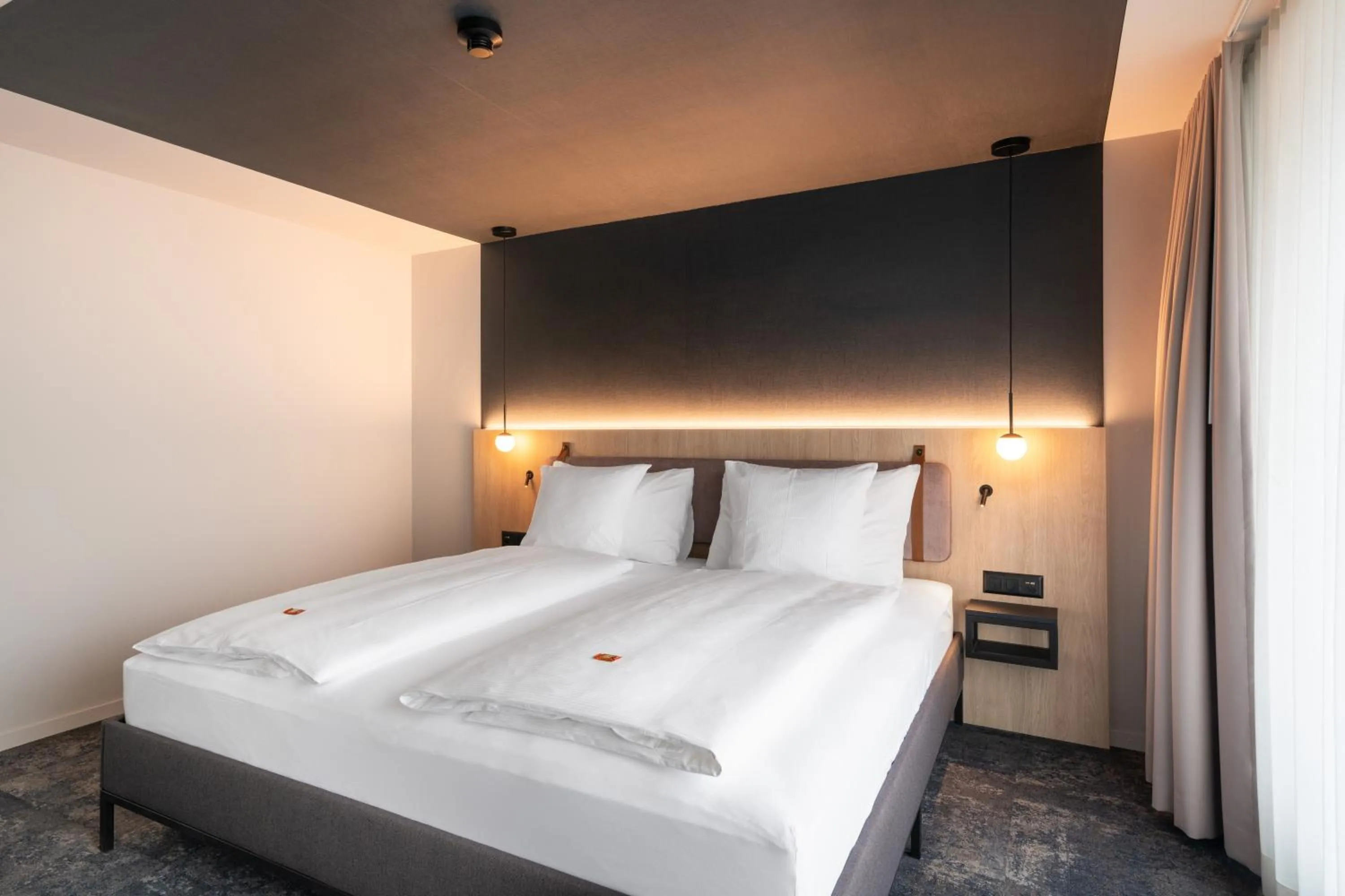 Bed in Stella Swiss Quality Hotel