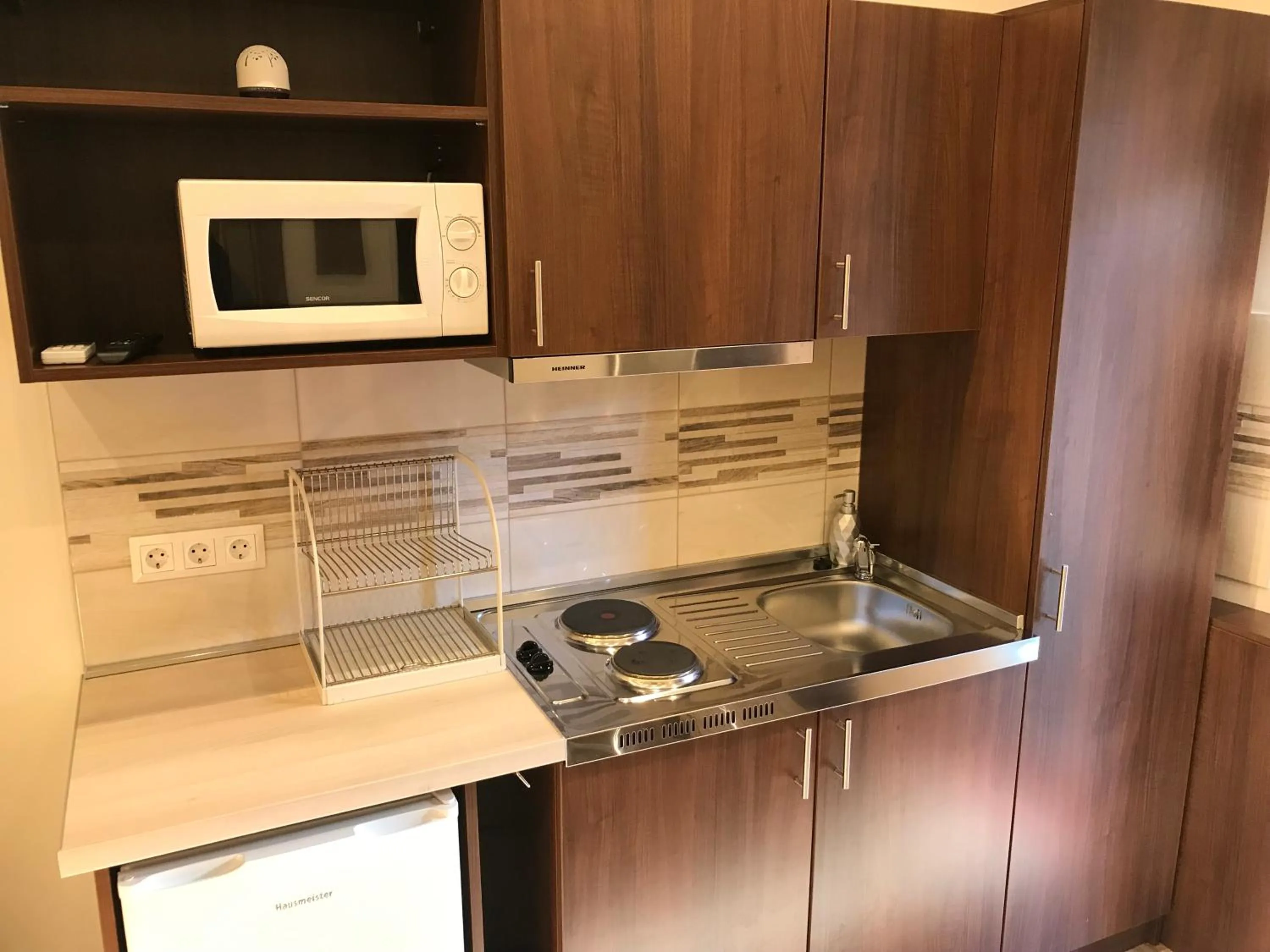 Kitchen or kitchenette in Termál Apartmanház